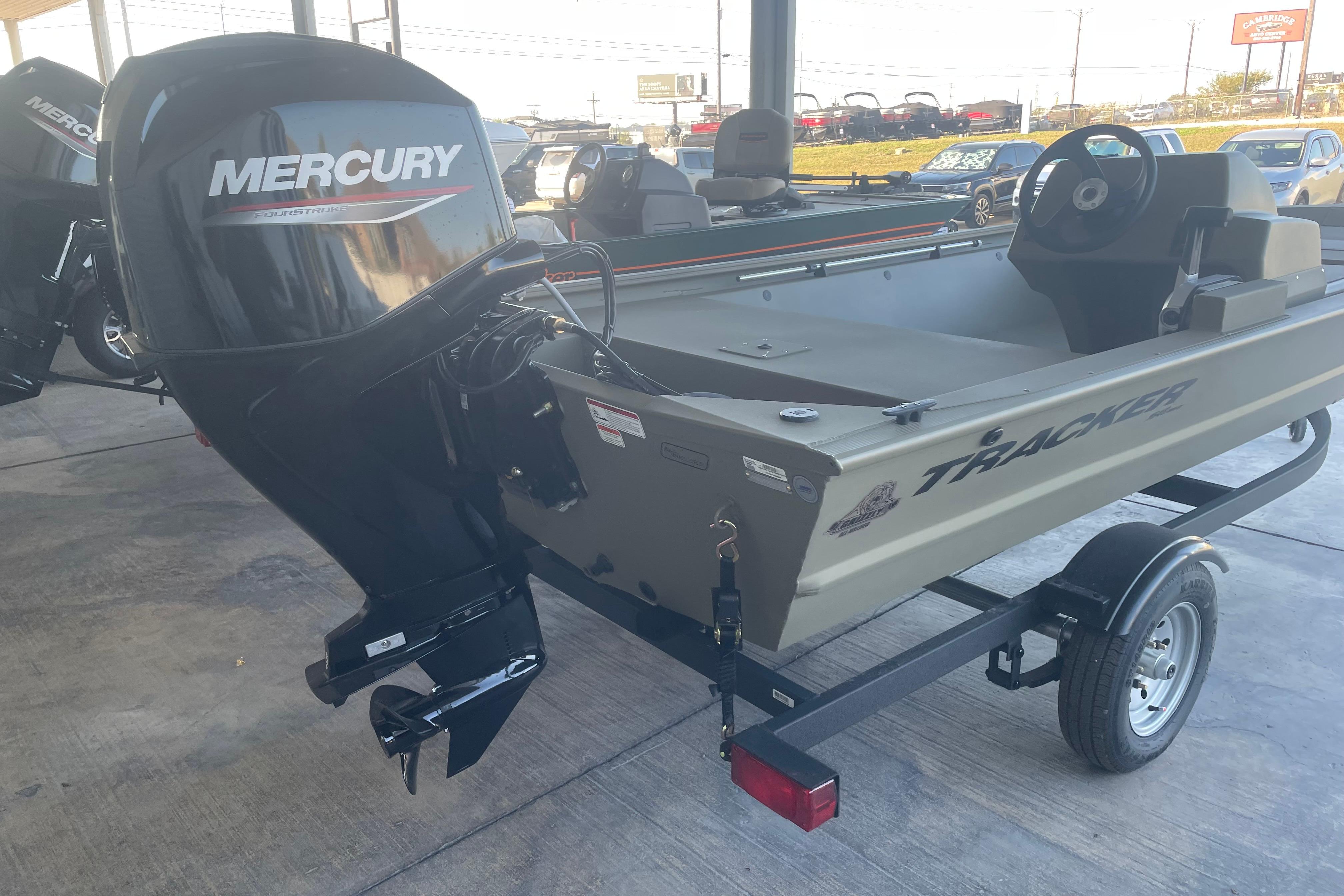 2026 Tracker Grizzly 1648 SC boat with Mercury outboard motor on trailer.