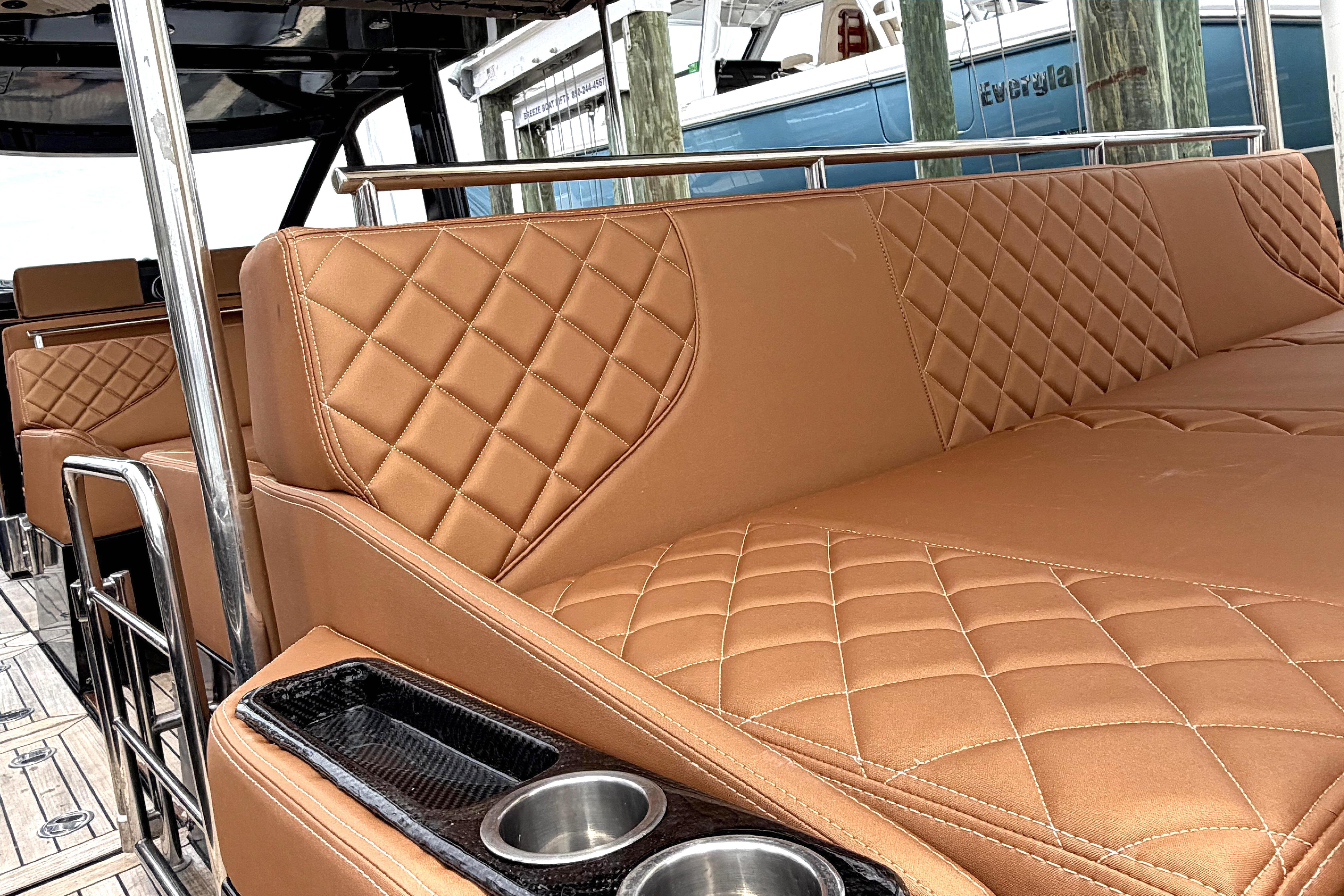 Luxurious leather seating on a 2013 Windy SR52 yacht, featuring elegant diamond stitching.
