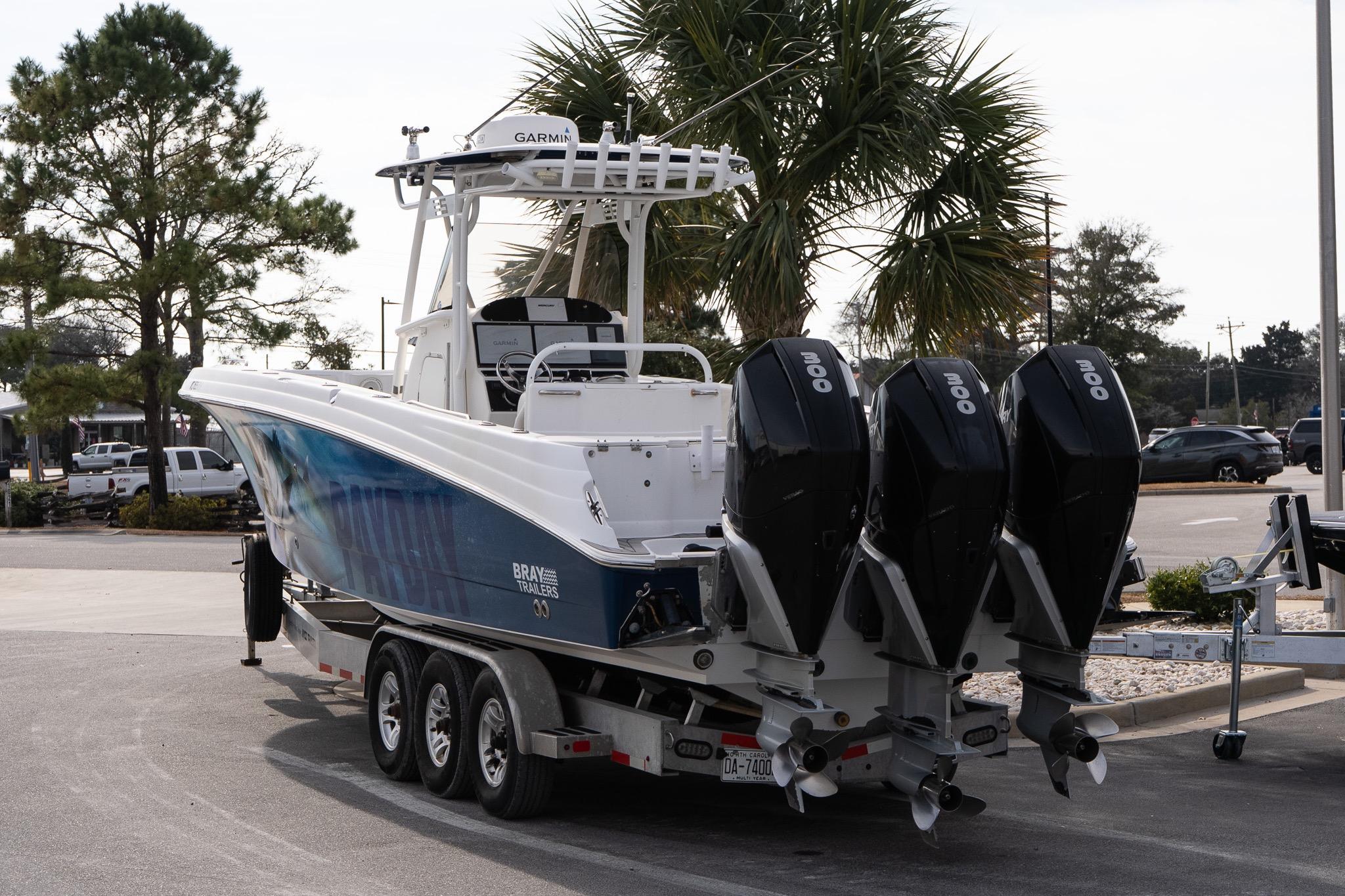 2007 Wellcraft 35 Tournament boat on trailer with triple outboard engines.