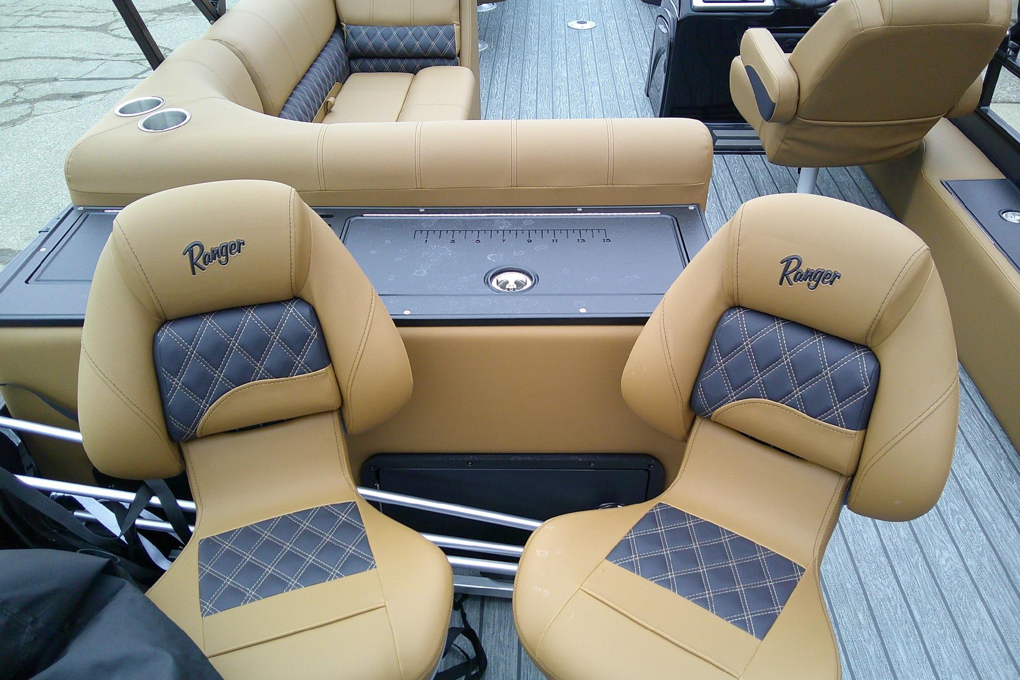 2026 Ranger 220FC boat interior with tan and black diamond-stitched seating.