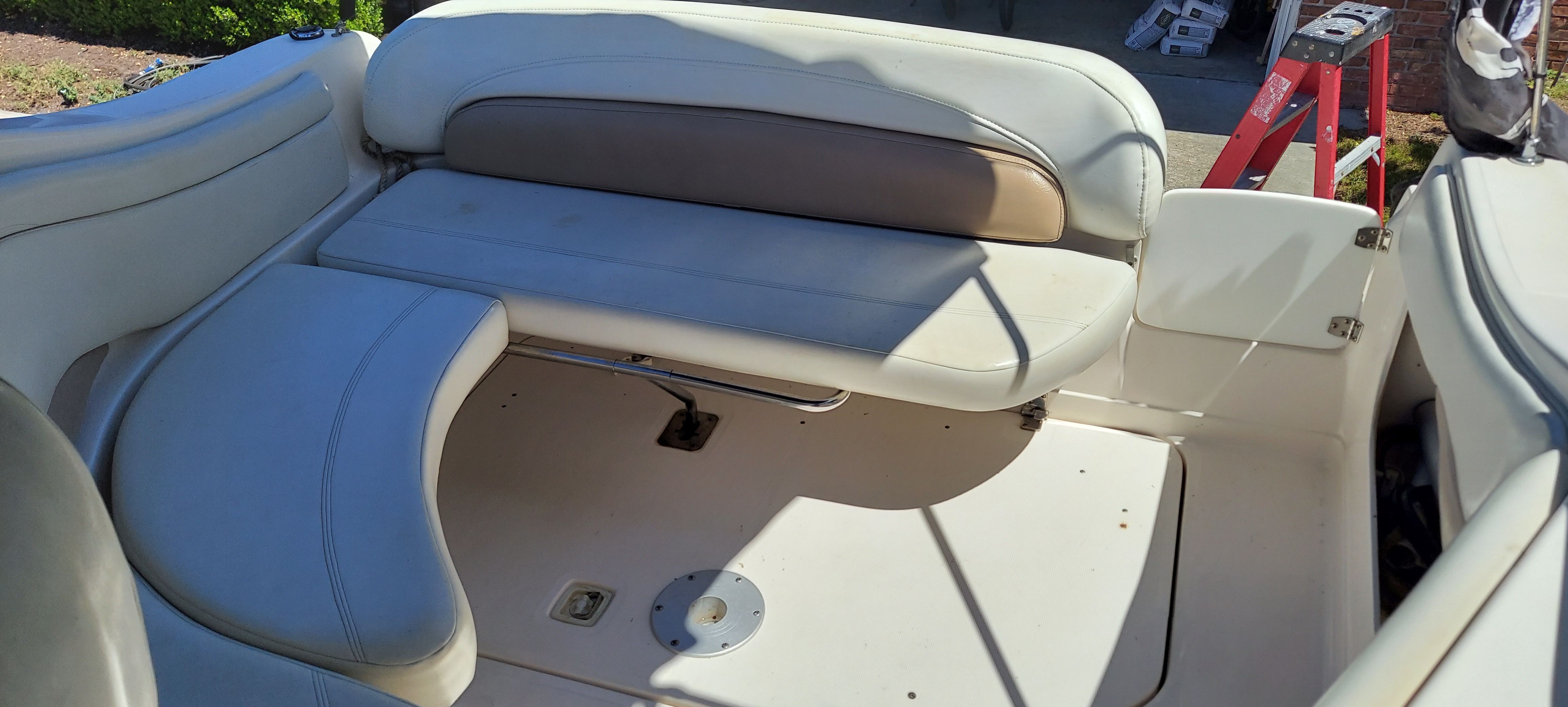 Interior of a 2004 Regal Commodore 2465 boat with seating area.