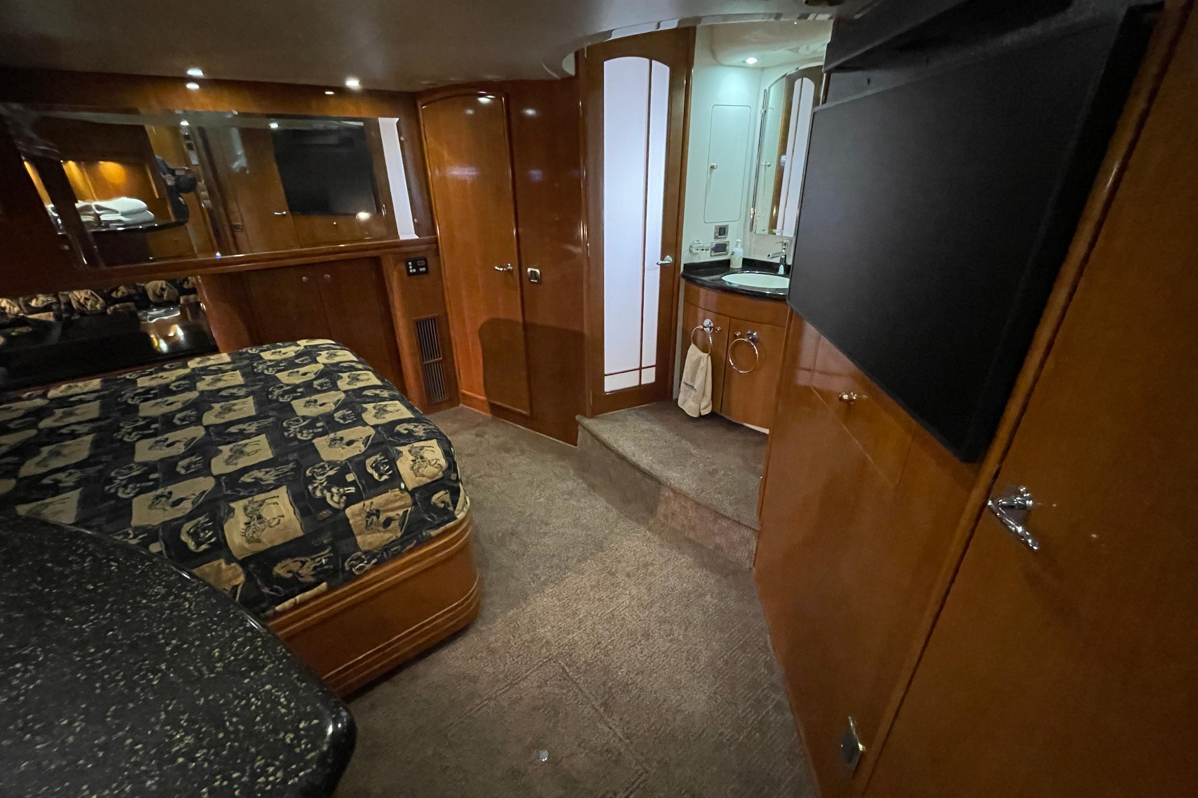 Luxurious interior of 2002 Carver 570 Voyager Pilothouse with elegant wood finishes.