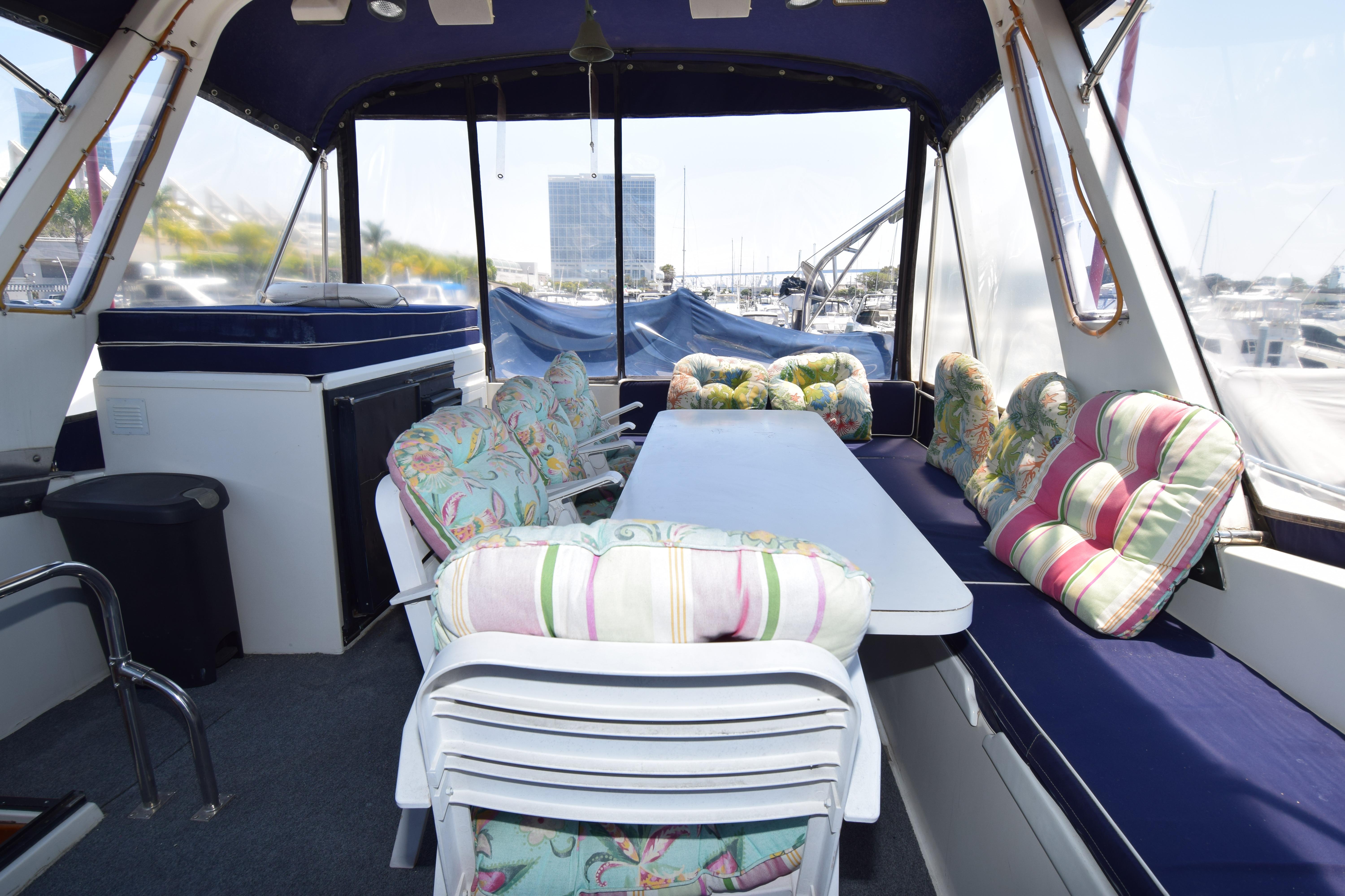 Interior of 1988 Sea Ranger 51 Motor Yacht with colorful seating and table.