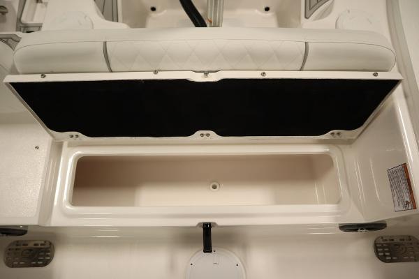 2025 Sea Fox 228 Commander boat storage compartment, open and empty.