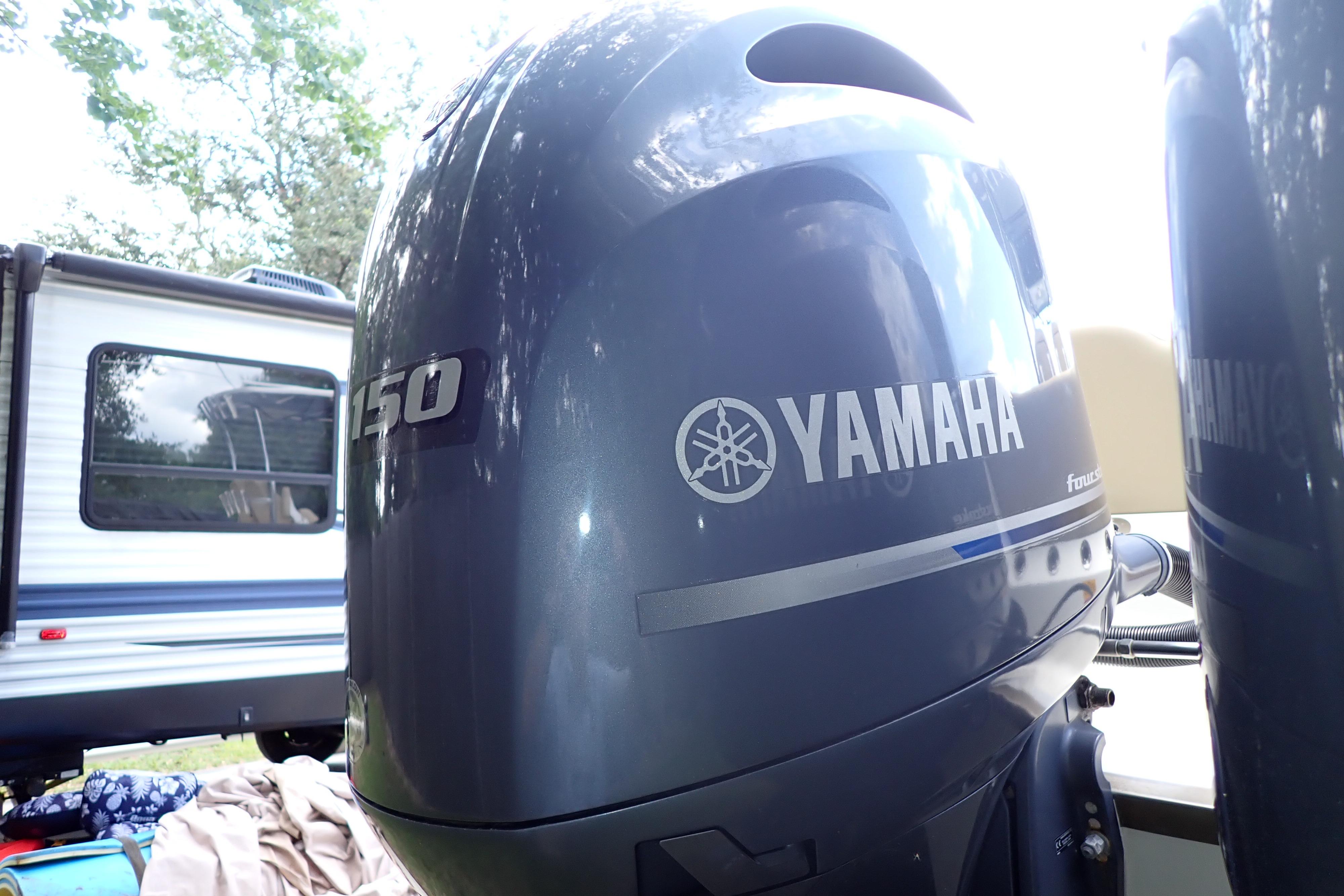 Yamaha 150 outboard motor on 2019 Key West 263 FS boat, with RV in background.
