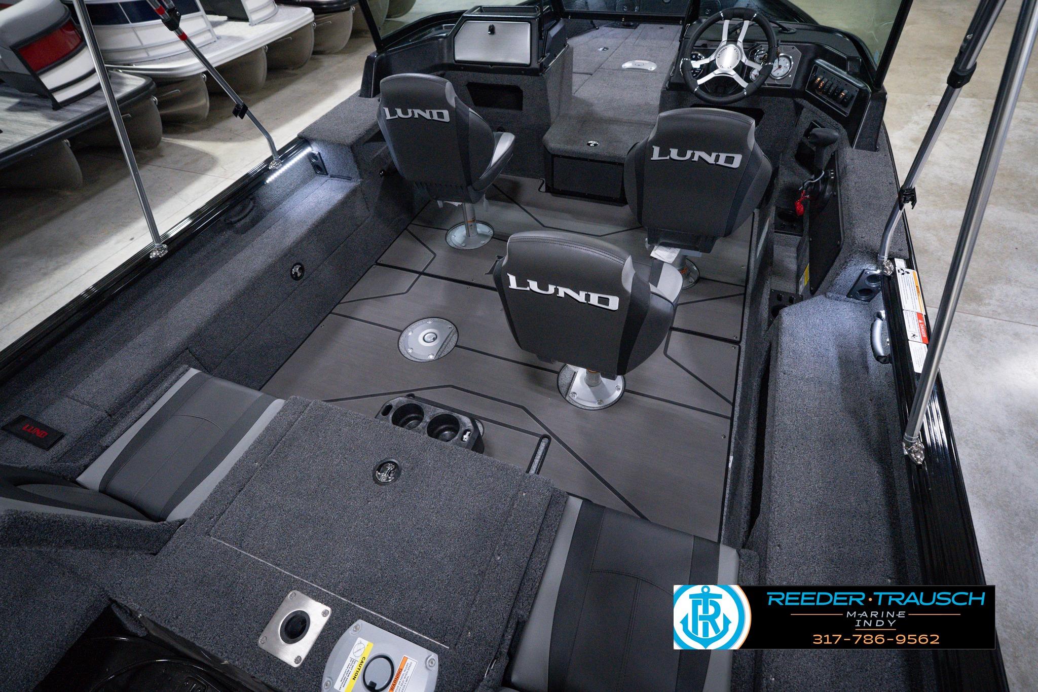 Interior of 2026 Lund 1875 Impact XS SS boat with seating and steering console.