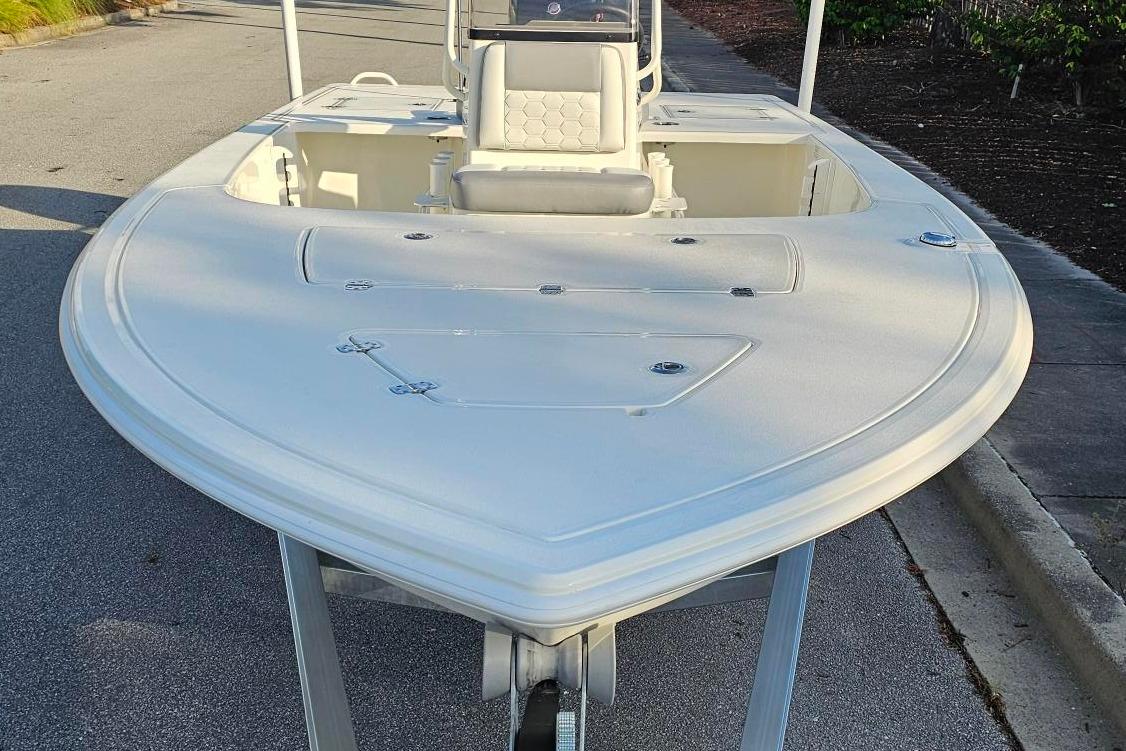 2026 Mako 18 Pro Skiff boat on trailer, viewed from the front.