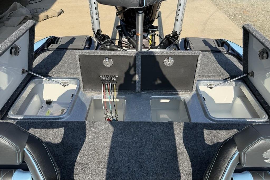 2026 Phoenix 20 XE boat interior with open storage compartments and wiring.
