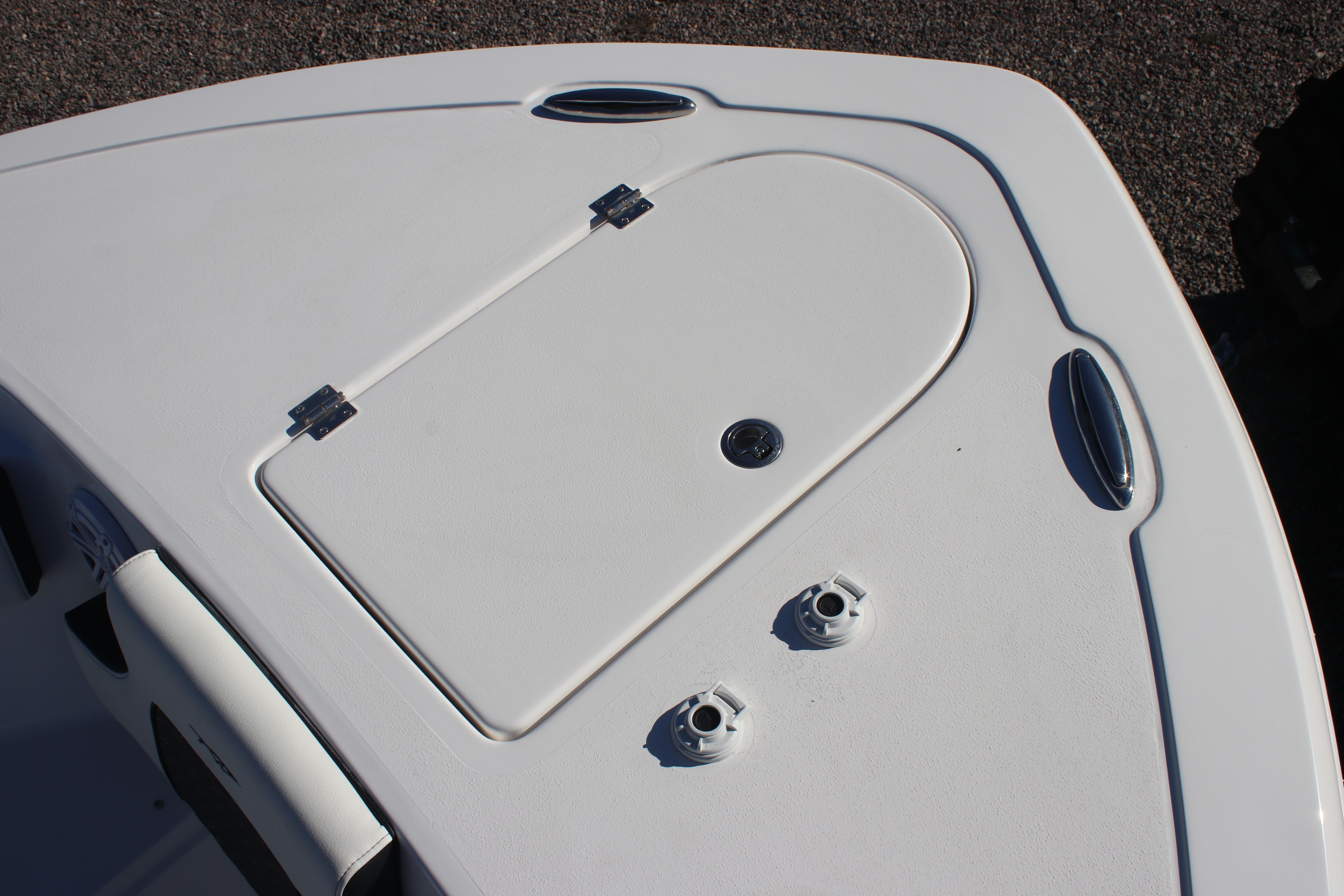 2026 Tidewater 232 CC Adventure boat deck with storage hatch and fittings.