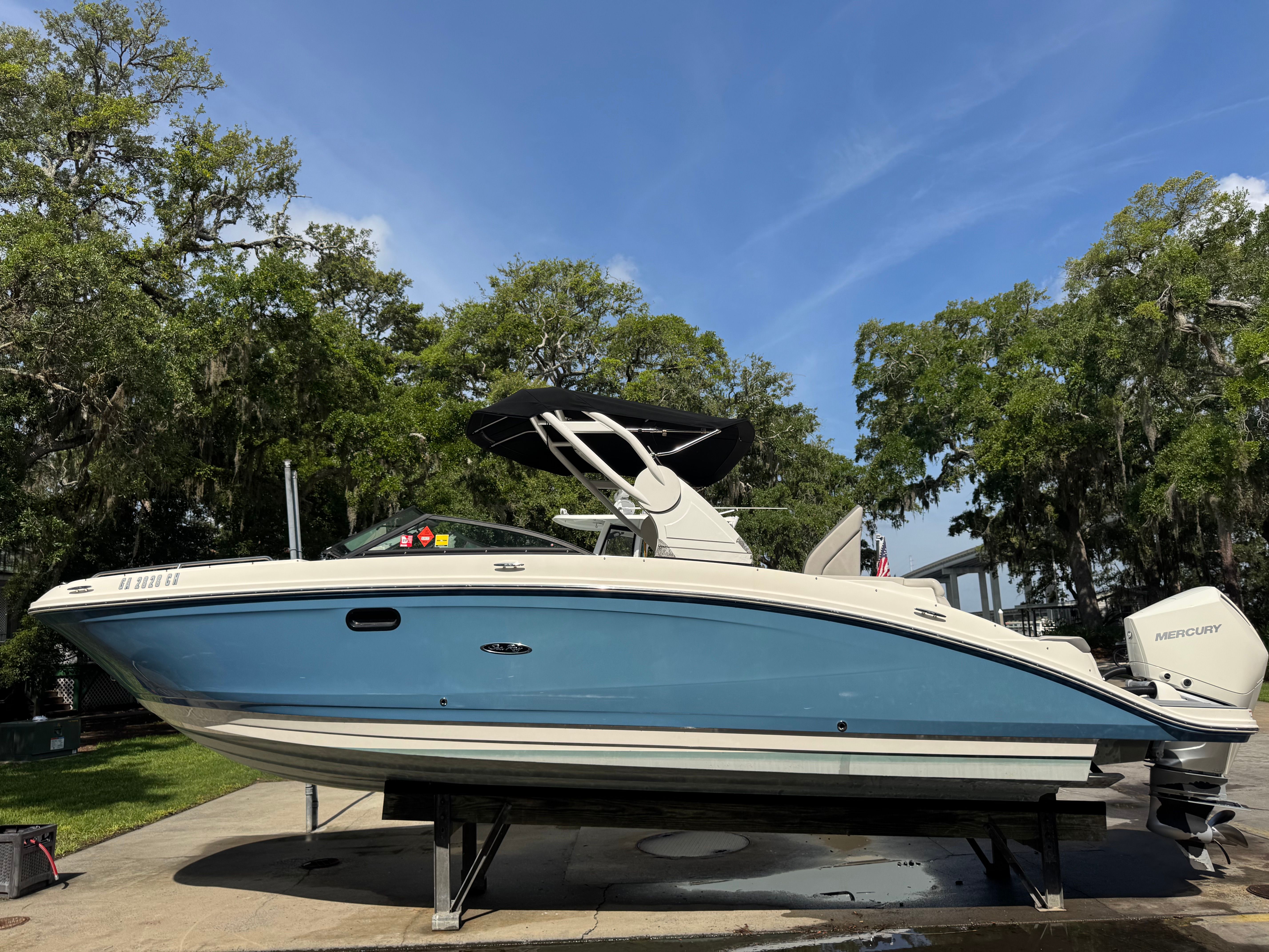 2020 Sea Ray SDX 270 Outboard boat on a trailer outdoors.