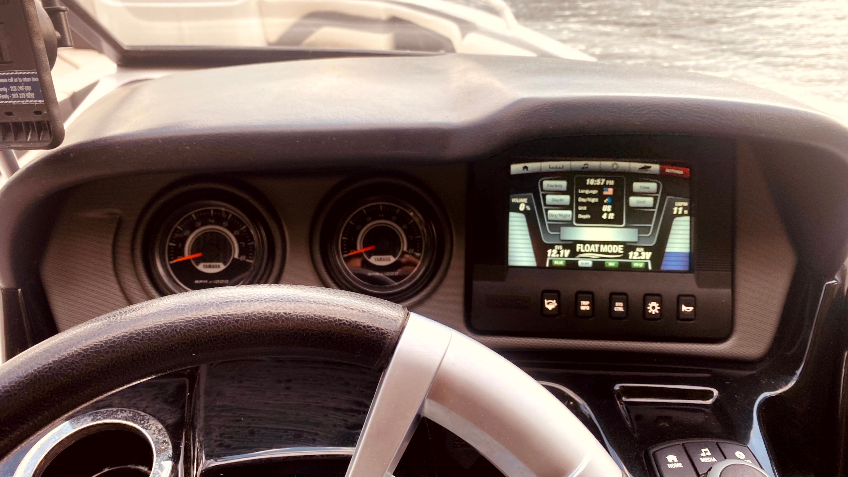 Dashboard of a 2016 Yamaha AR240 boat with controls and display.