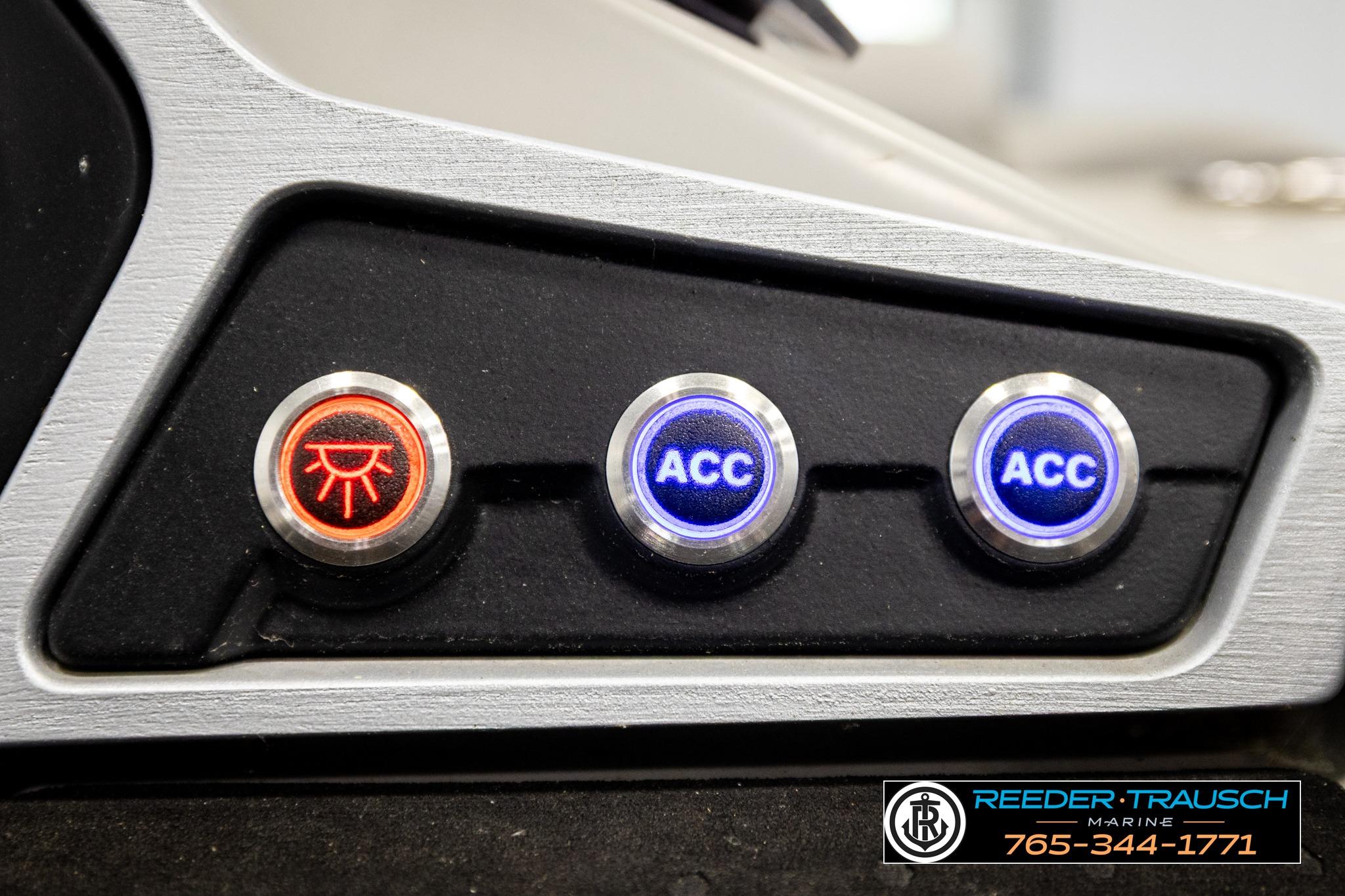 Control panel of a 2019 Manitou Oasis SR VP boat with illuminated buttons.