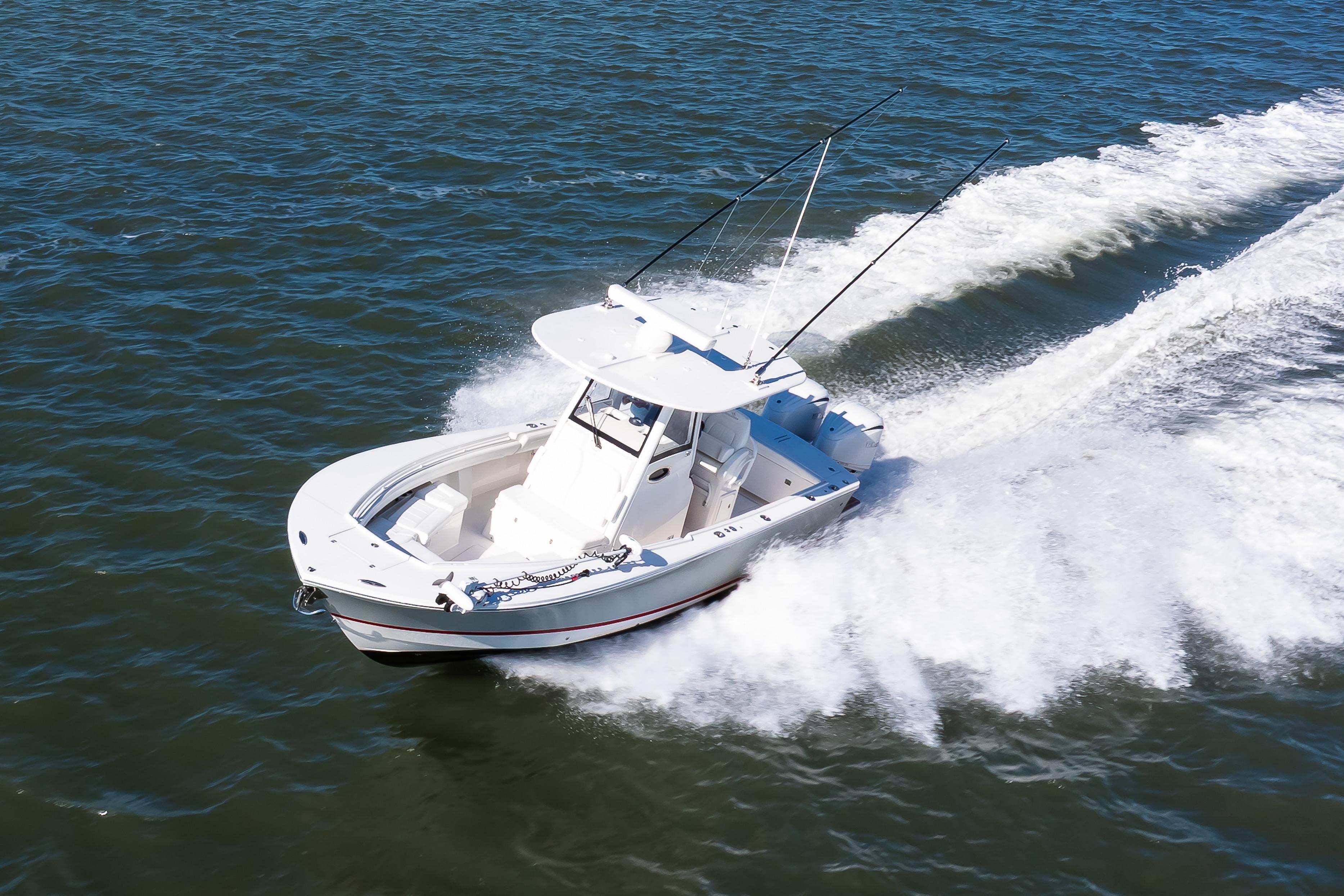 2022 Regulator 28 Forward Seating boat cruising on open water.