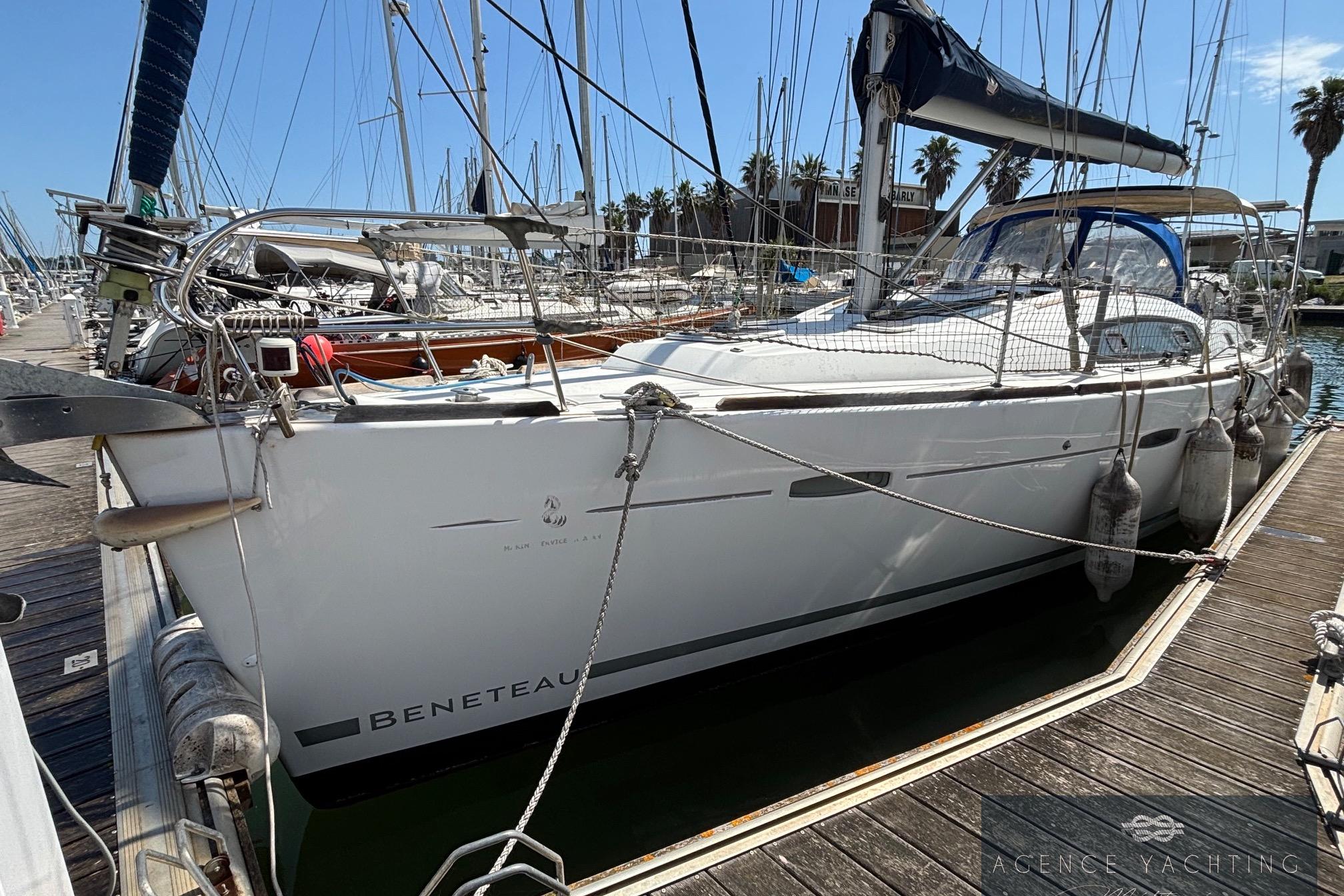 2008 Beneteau Oceanis 40 sailboat docked at marina, sunny day, clear sky.