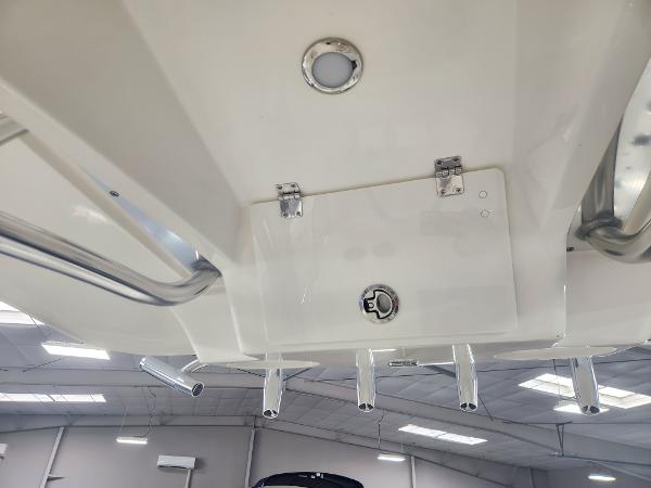 2025 Pathfinder 2400 Open boat interior, featuring rod holders and ceiling details.