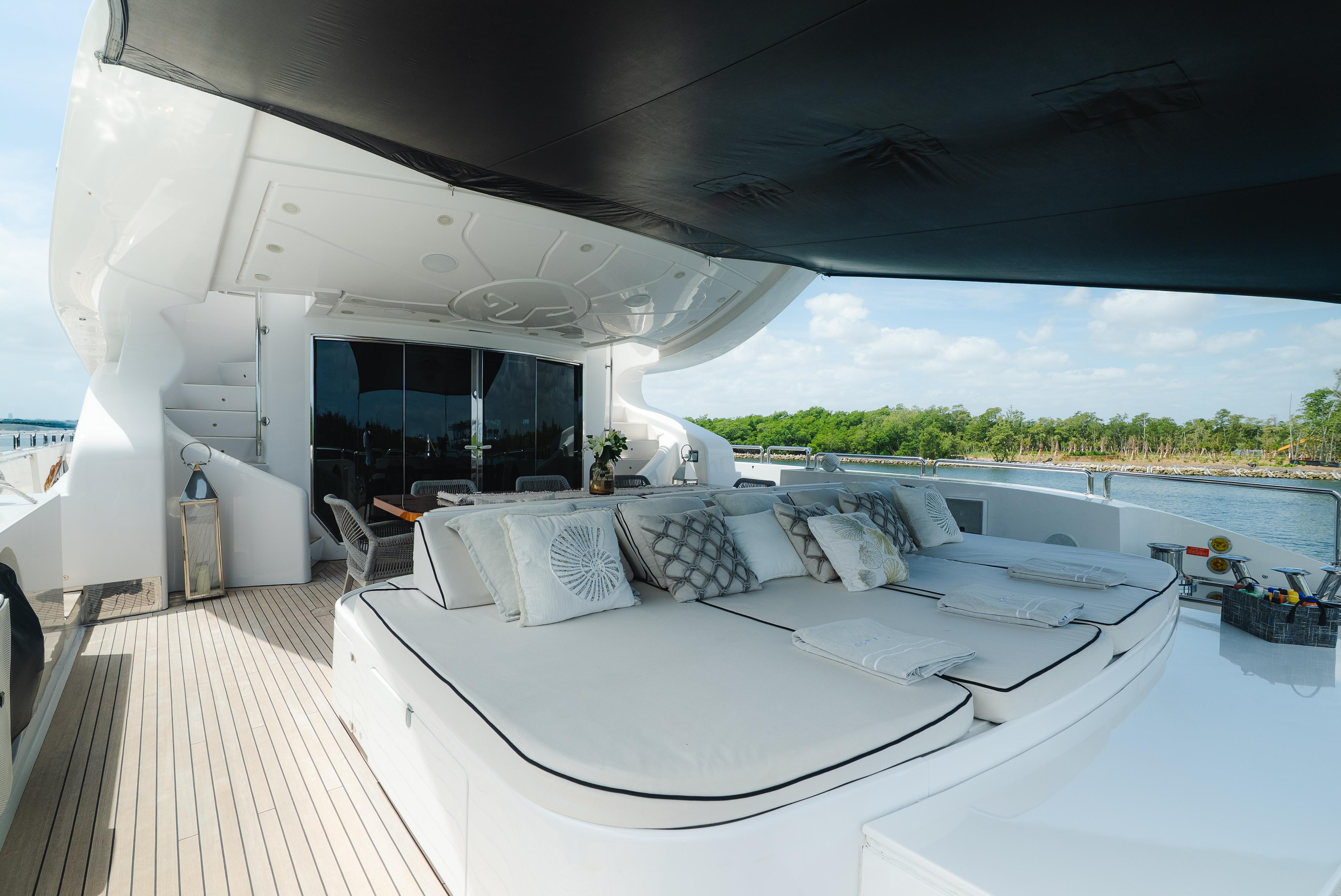 Luxurious deck of 2010 Arno Leopard 46 yacht with elegant seating and scenic view.
