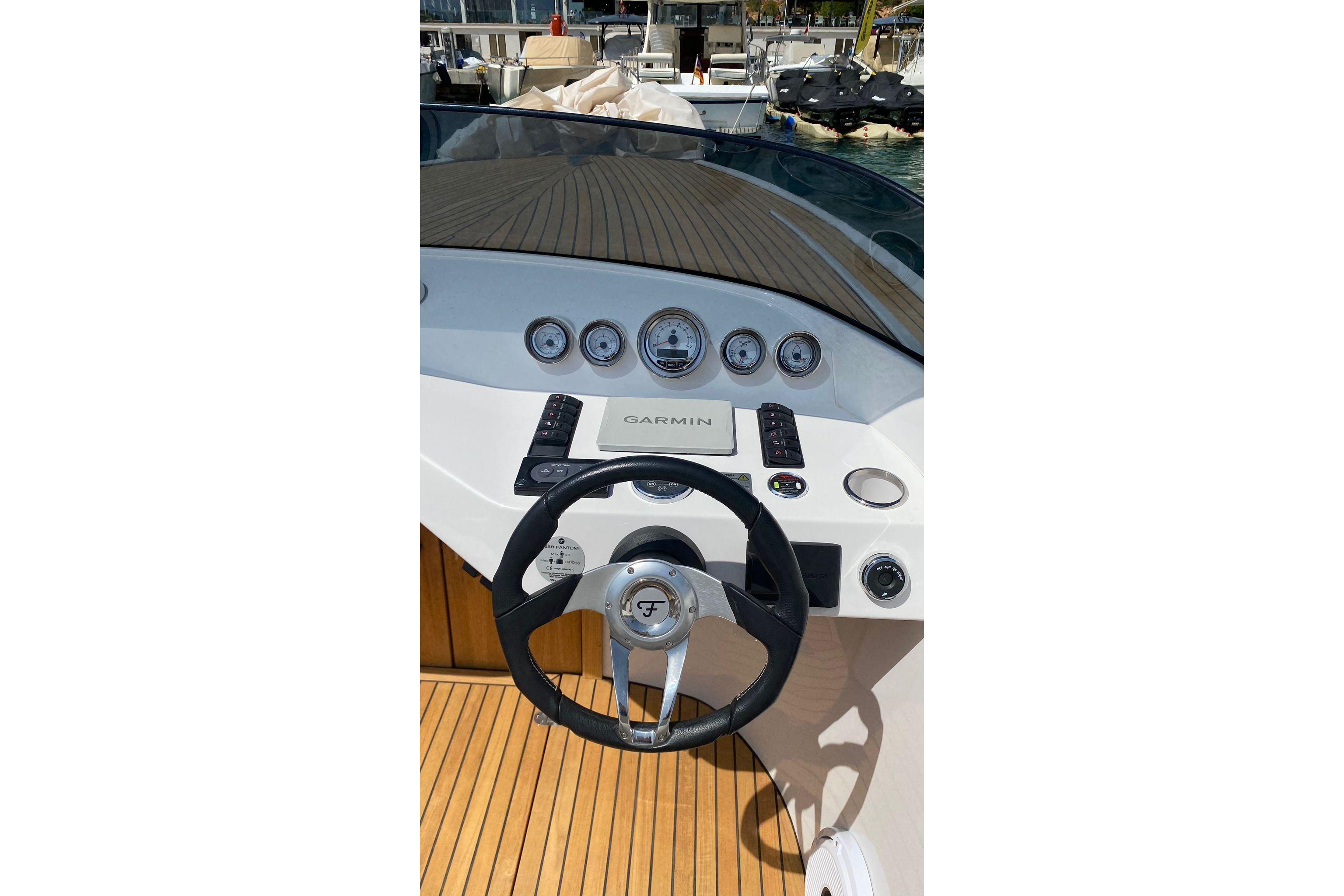 Steering console of 2021 Frauscher 858 Fantom boat with Garmin navigation system.