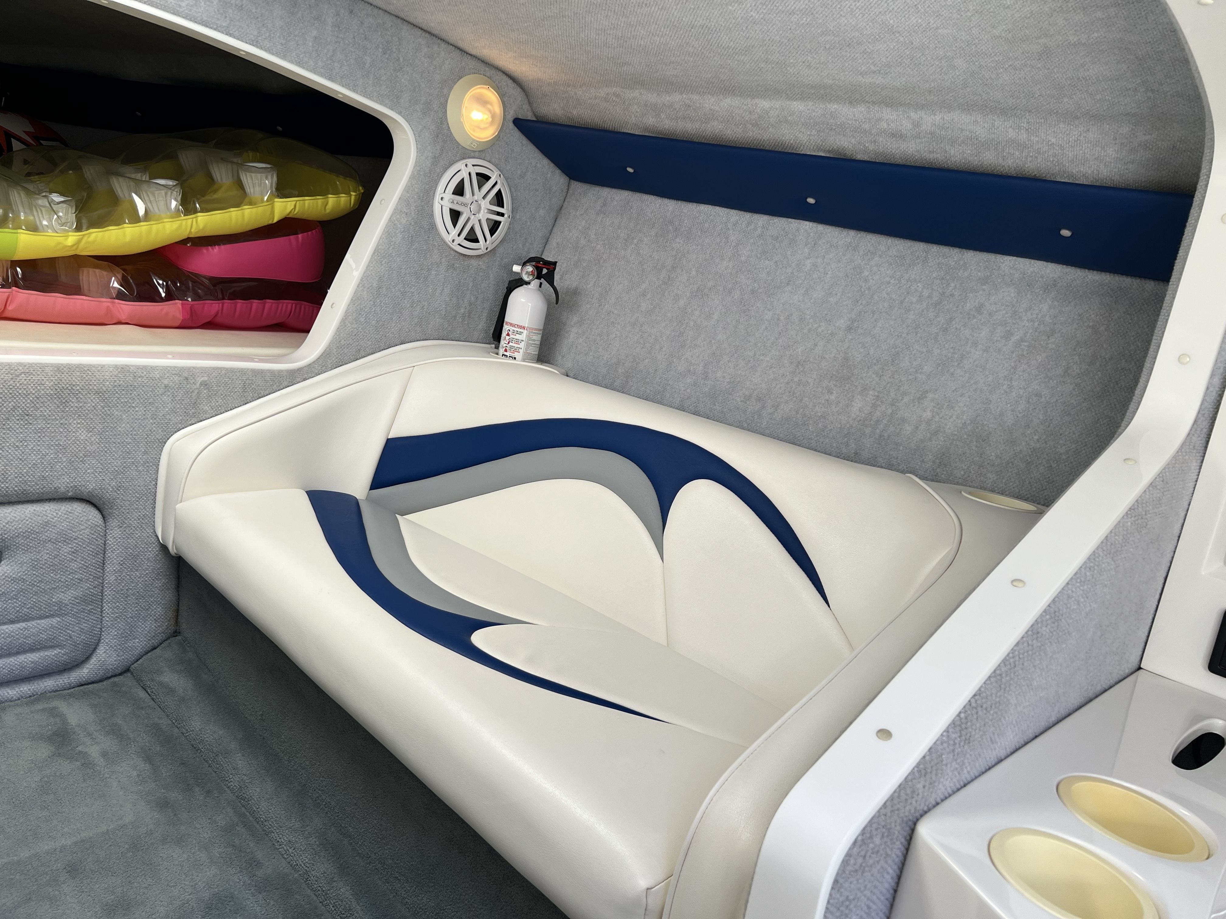 Interior of 2007 Nordic Powerboats Heat with seating and speaker.