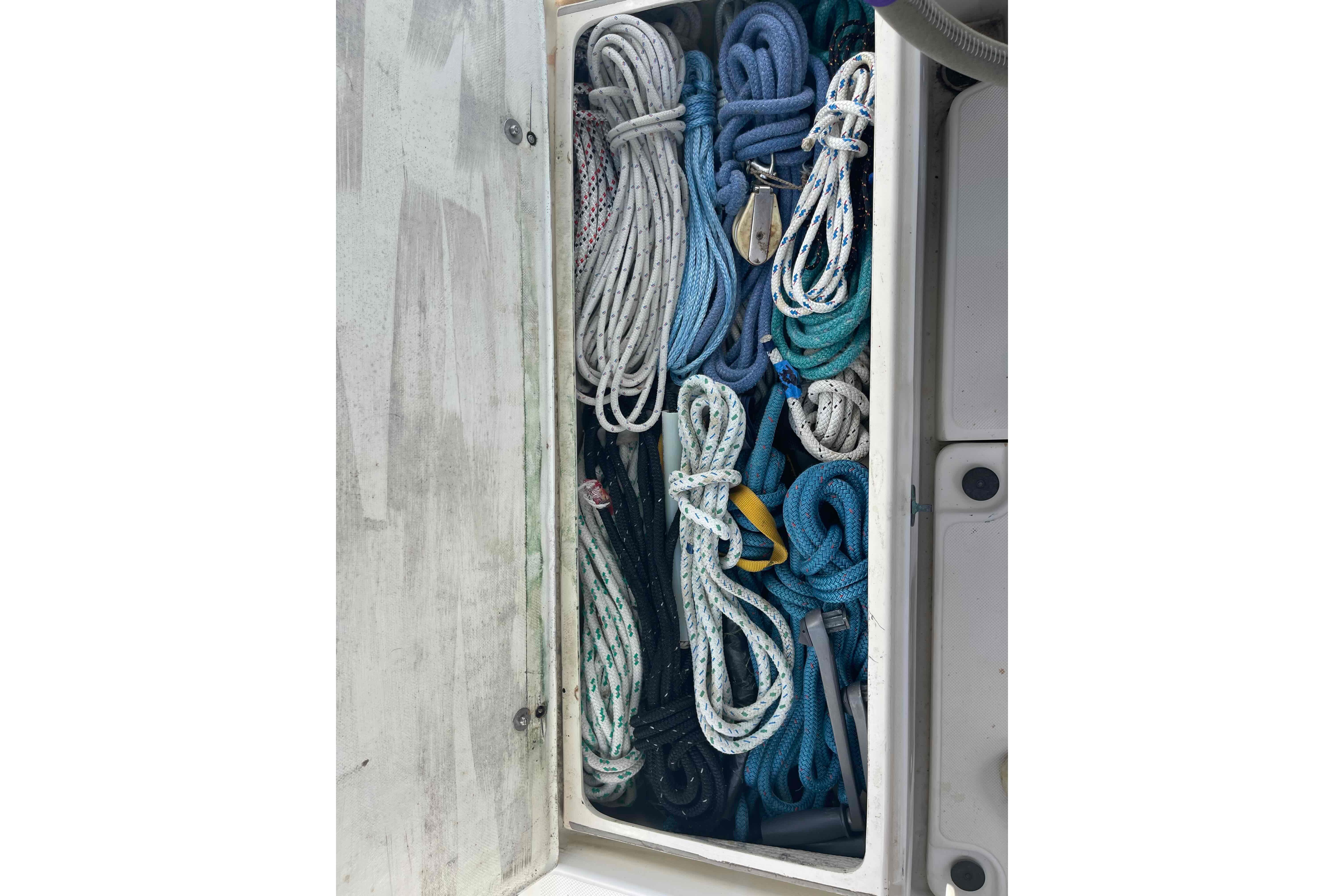 Organized ropes in storage compartment of 1987 Pacific Seacraft 34 sailboat.