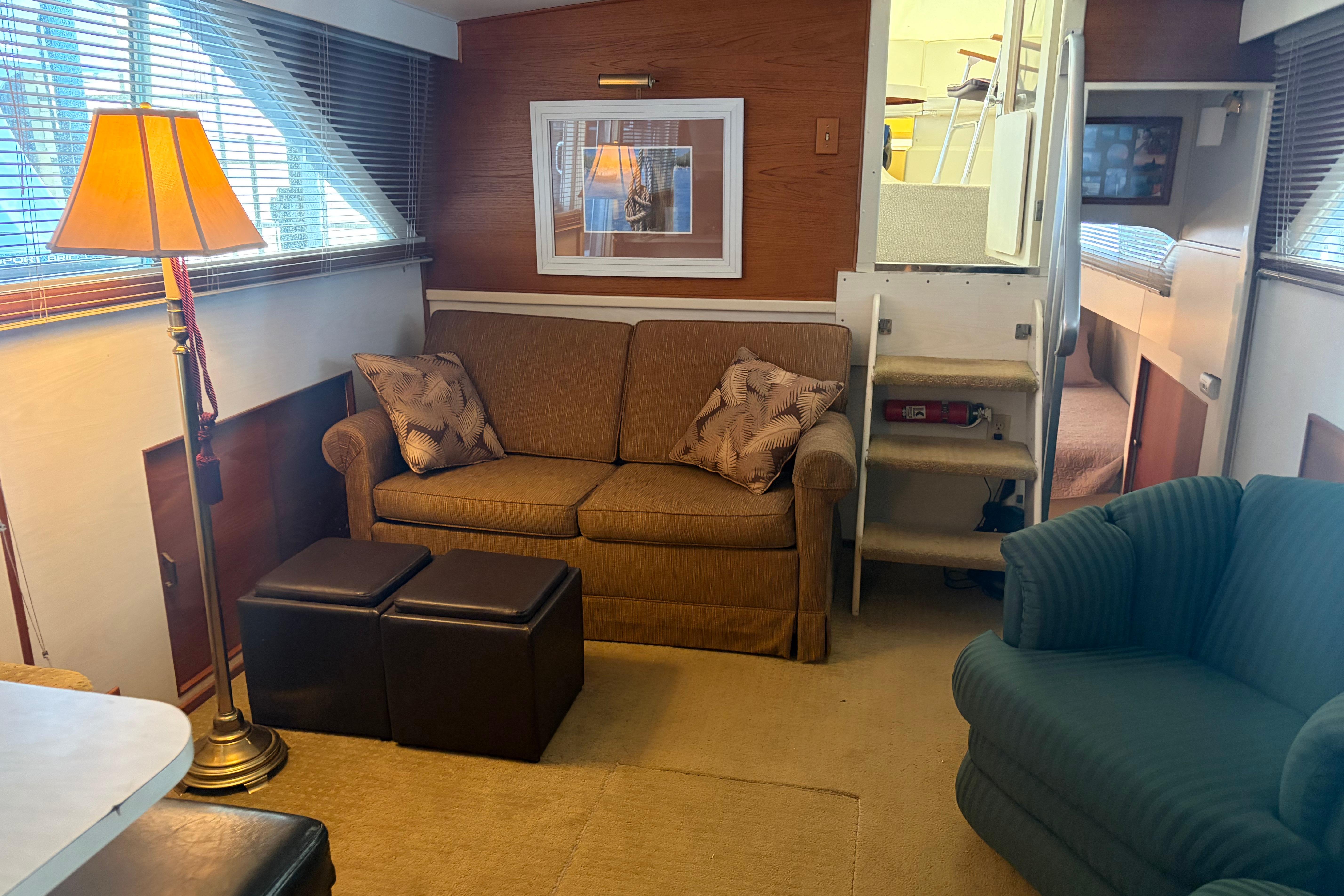 Interior of a 1971 Chris-Craft 42 Commander yacht with cozy seating and decor.