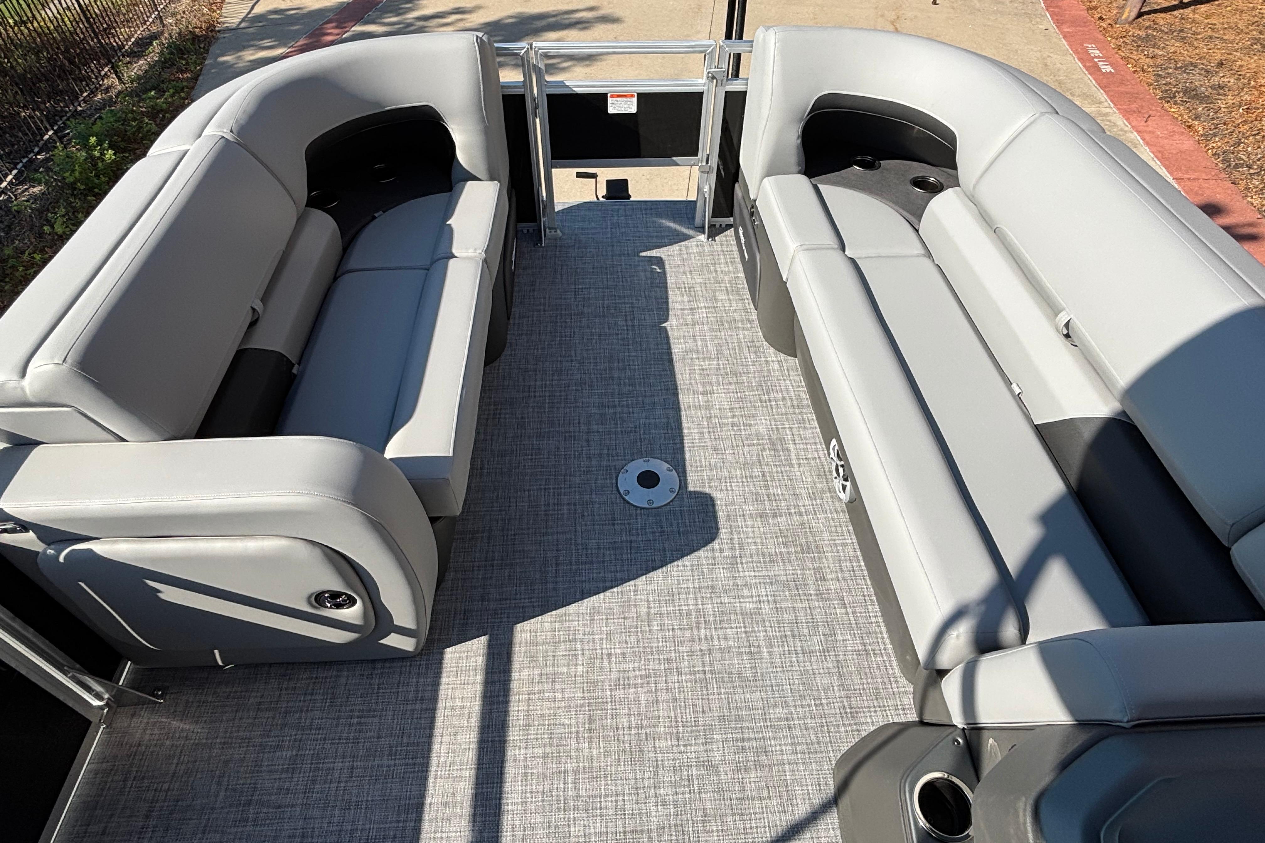 2026 Sun Tracker SportFish 22 DLX pontoon boat interior with spacious seating.