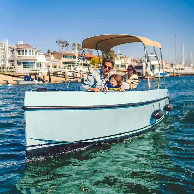Family enjoying a ride on 2023 Vision Marine Technologies Volt 180 boat.