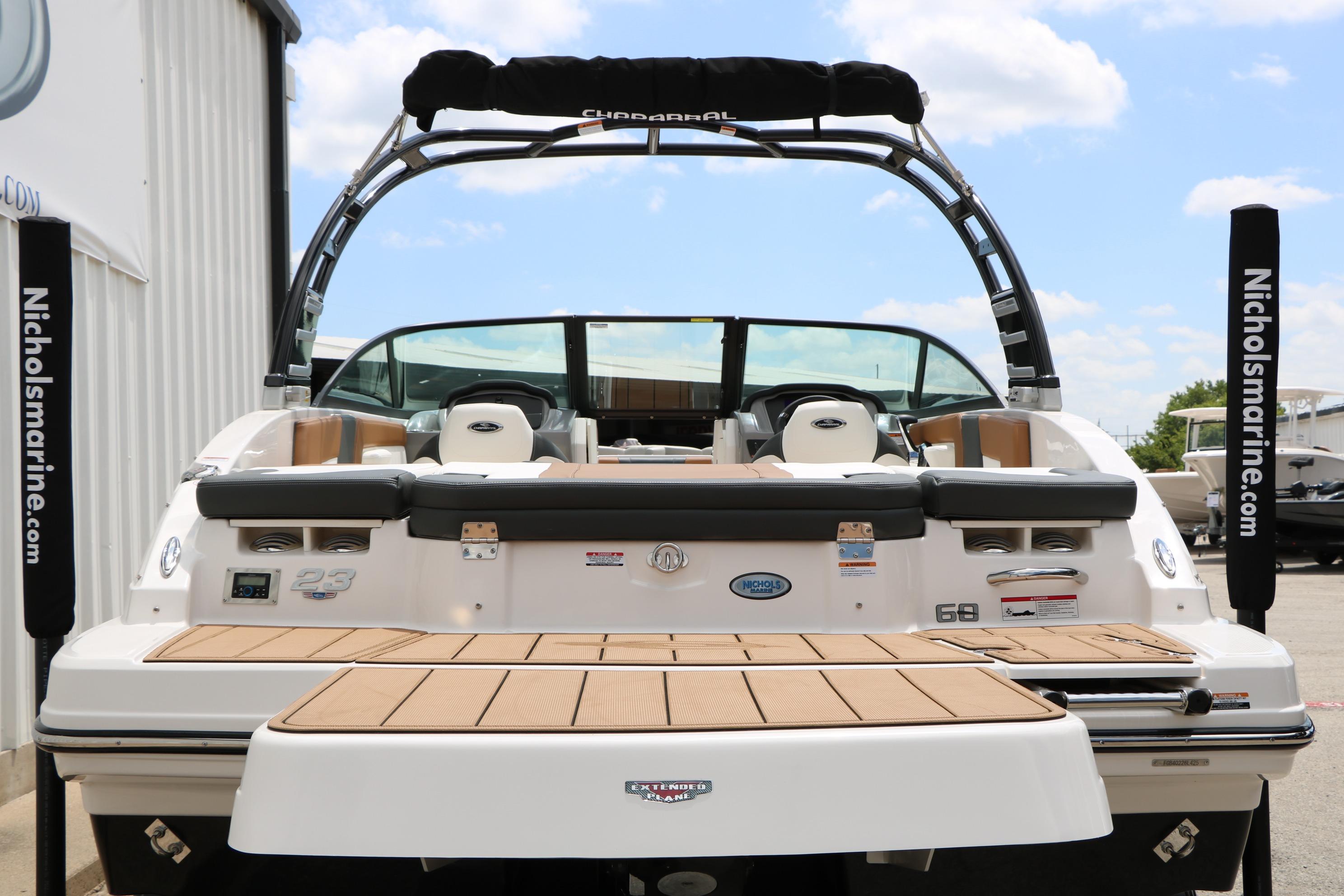 2025 Chaparral 23 SSi boat rear view with swim platform and seating.
