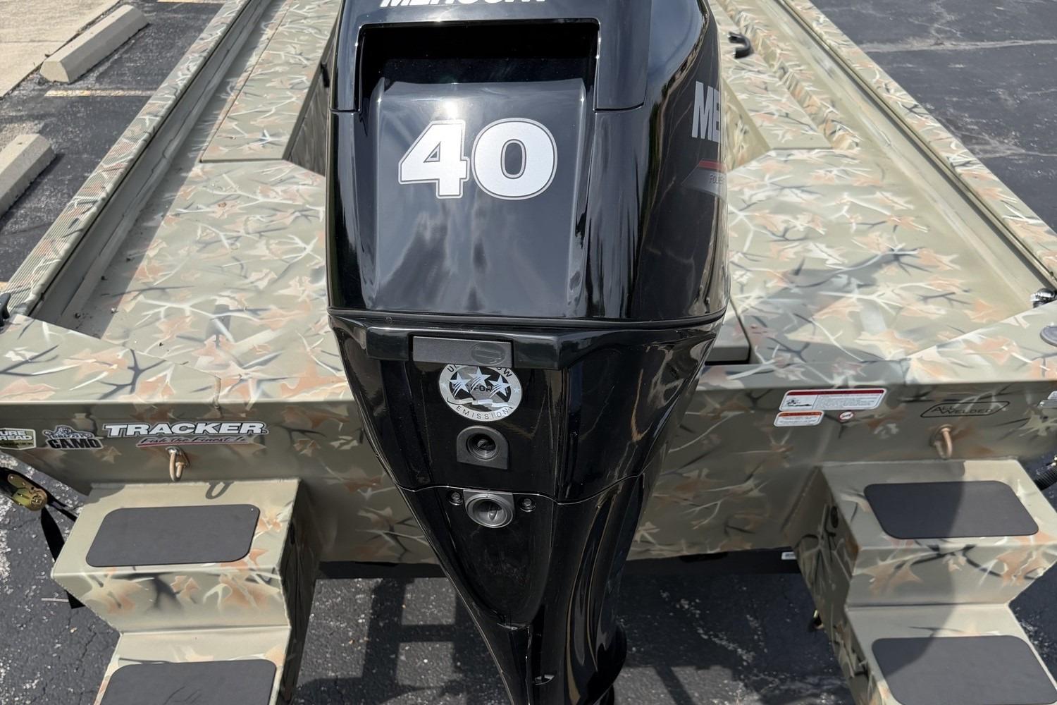 2025 Tracker Grizzly 1654 T Sportsman boat with camo design and Mercury 40 outboard motor.