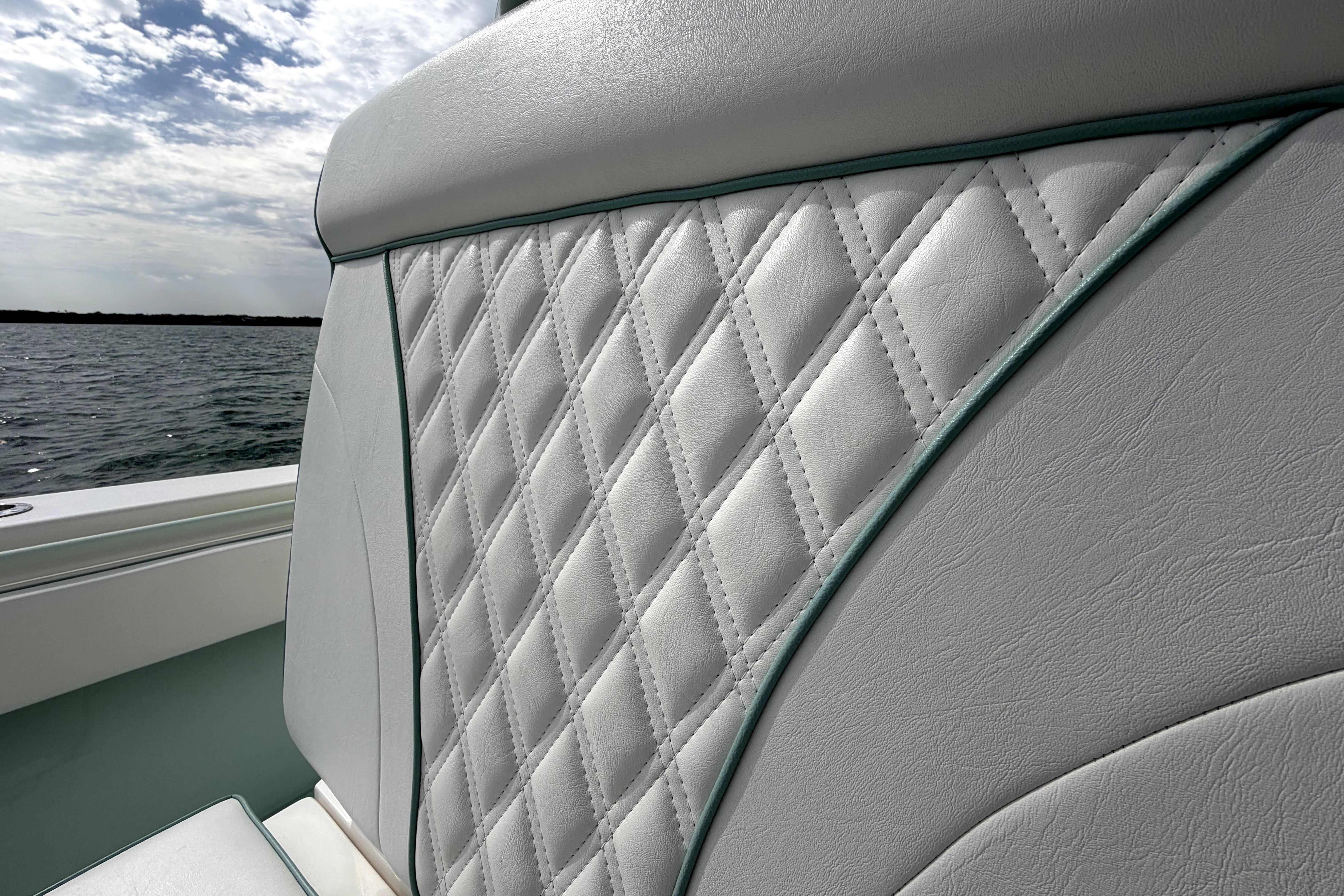 Quilted seat detail on 2019 Contender 30 ST boat with ocean backdrop.