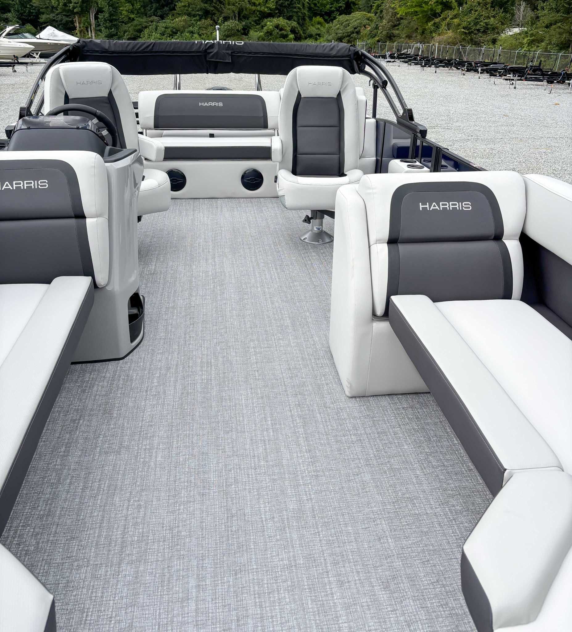 Interior of 2026 Harris Cruiser 230 SLDH with luxurious seating.