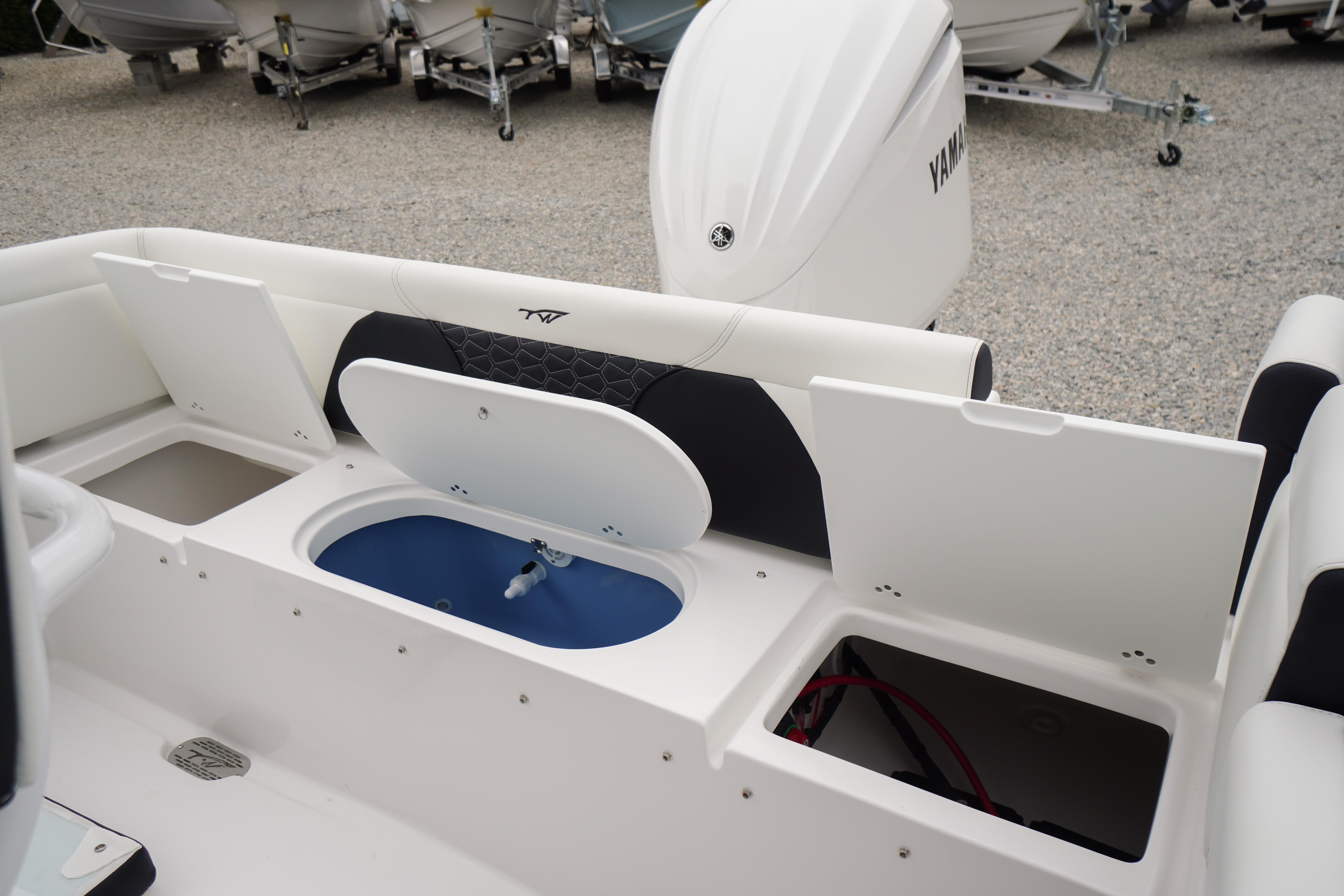 2026 Tidewater 232 SS boat interior with storage compartments and Yamaha engine.