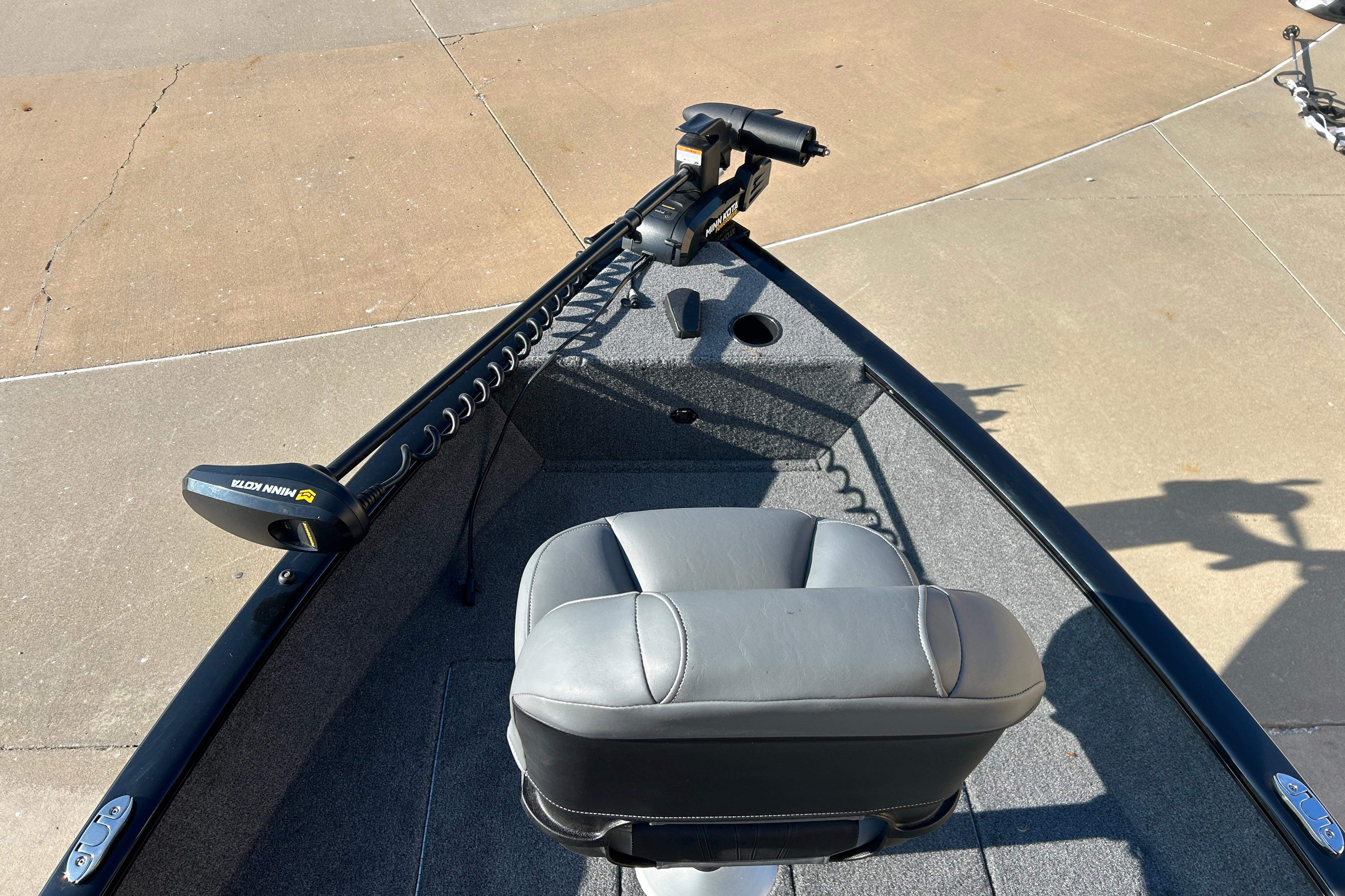 2025 Tracker Super Guide V-16 T boat with Minn Kota trolling motor and gray seating.