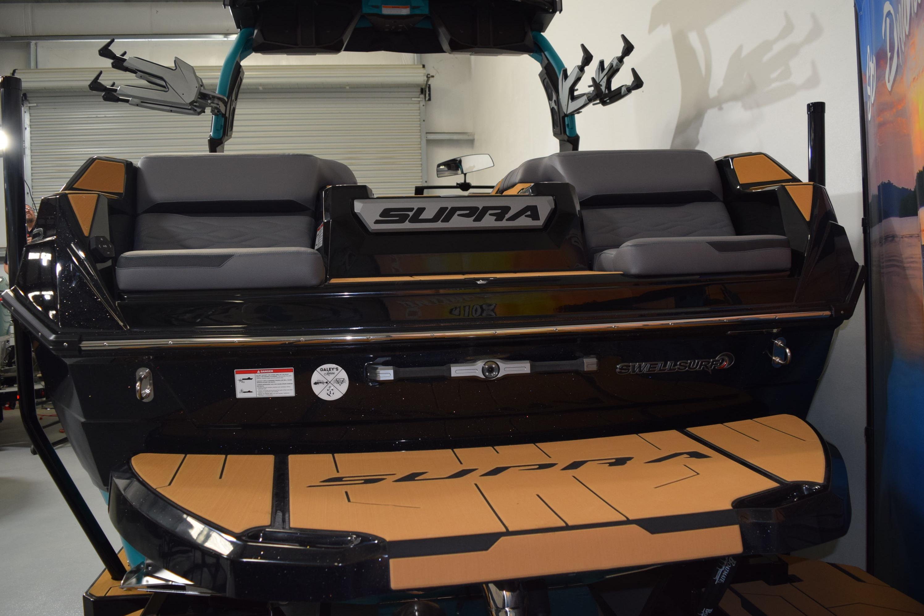 2026 Supra SL 550 boat interior with cushioned seating and SwellSurf technology.