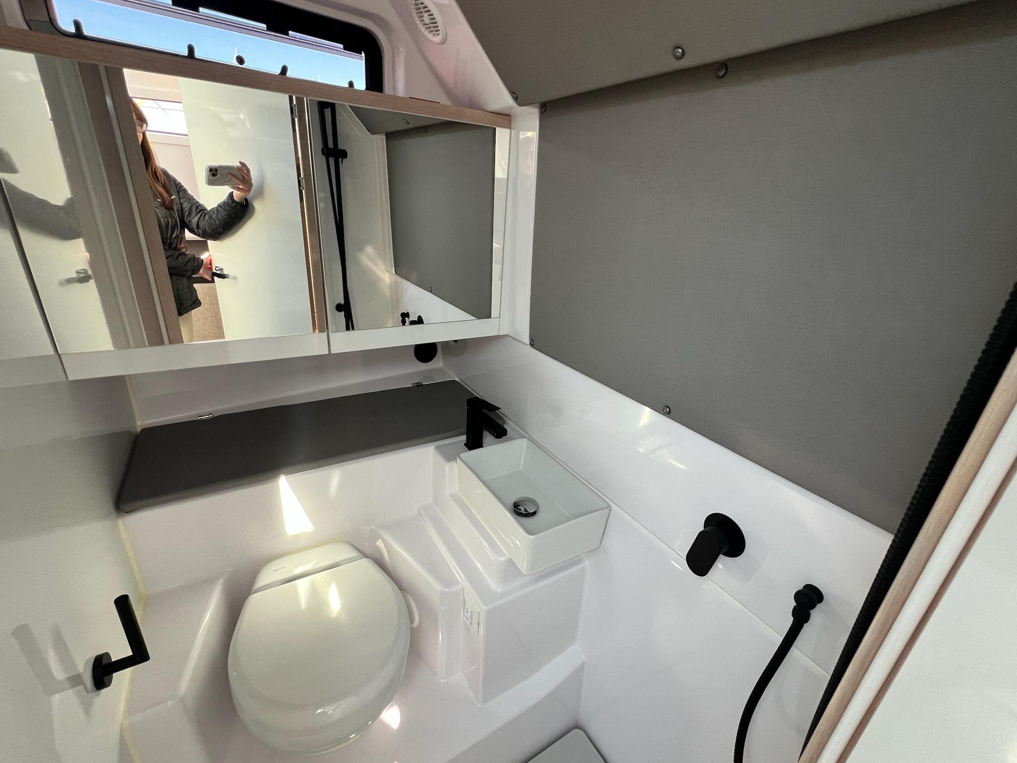 2024 Axopar 45 XC Cross Cabin bathroom with modern fixtures and sleek design.
