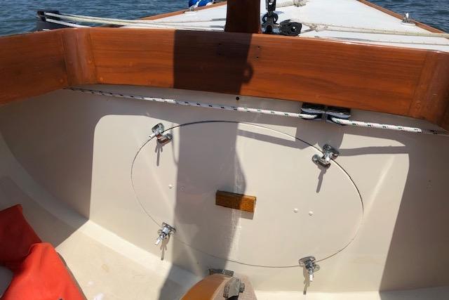 1963 Cape Cod Shipbuilding Shields sailboat cockpit with wooden trim and nautical equipment.