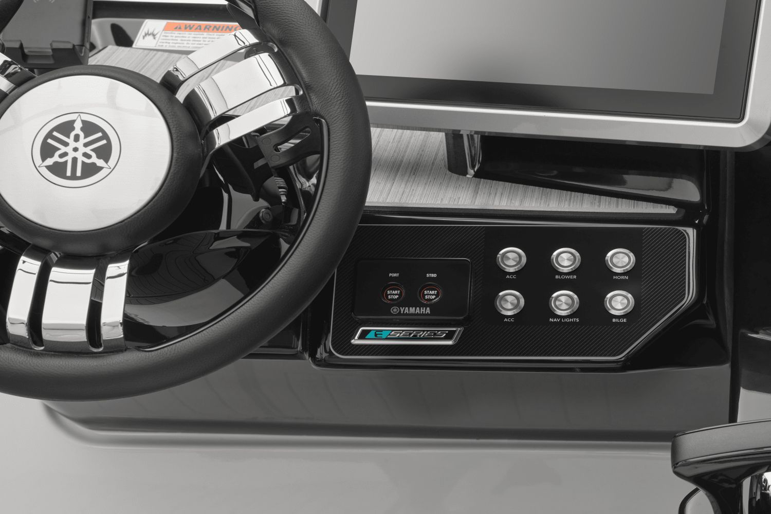 Close-up of the helm area of a Yamaha 222SD boat with modern controls.