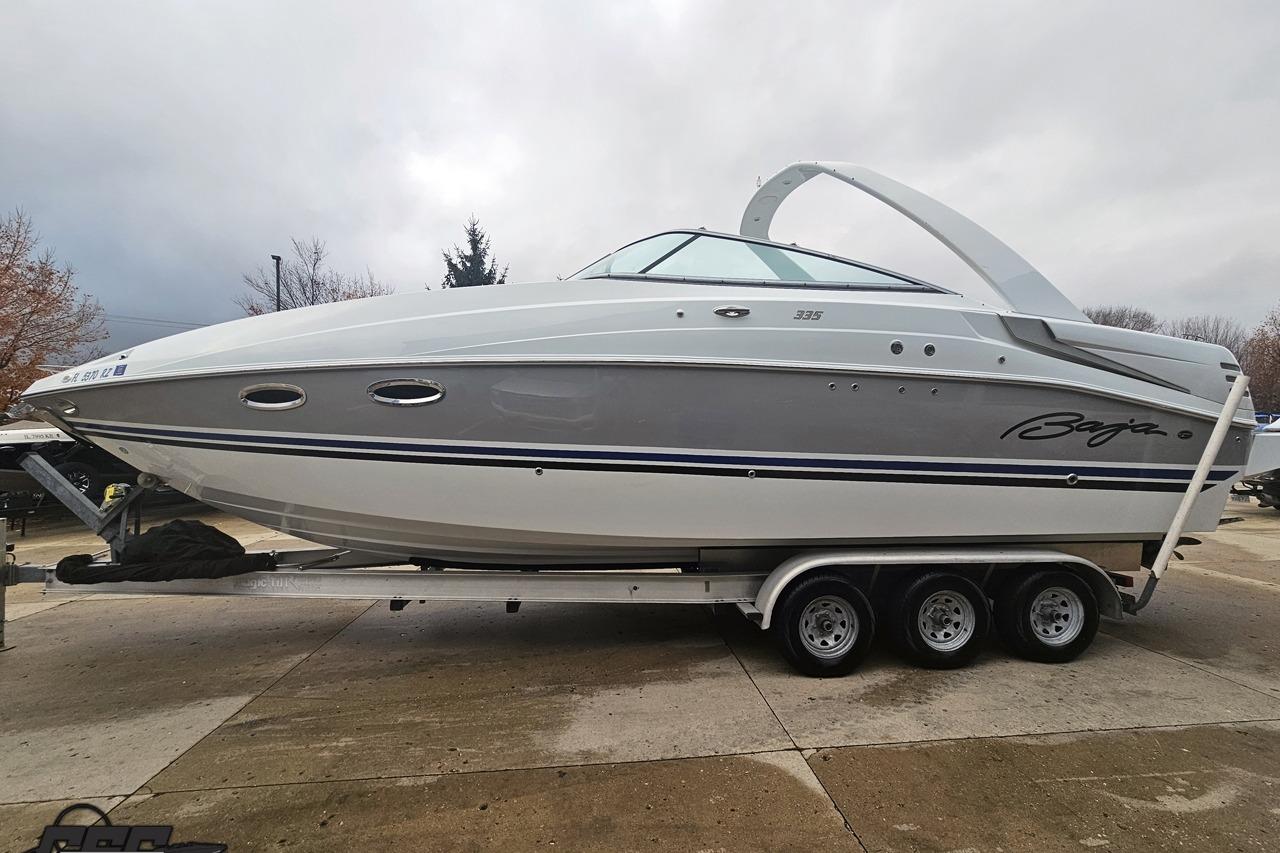 2008 Baja 335 Performance boat on trailer, sleek design, parked outdoors.