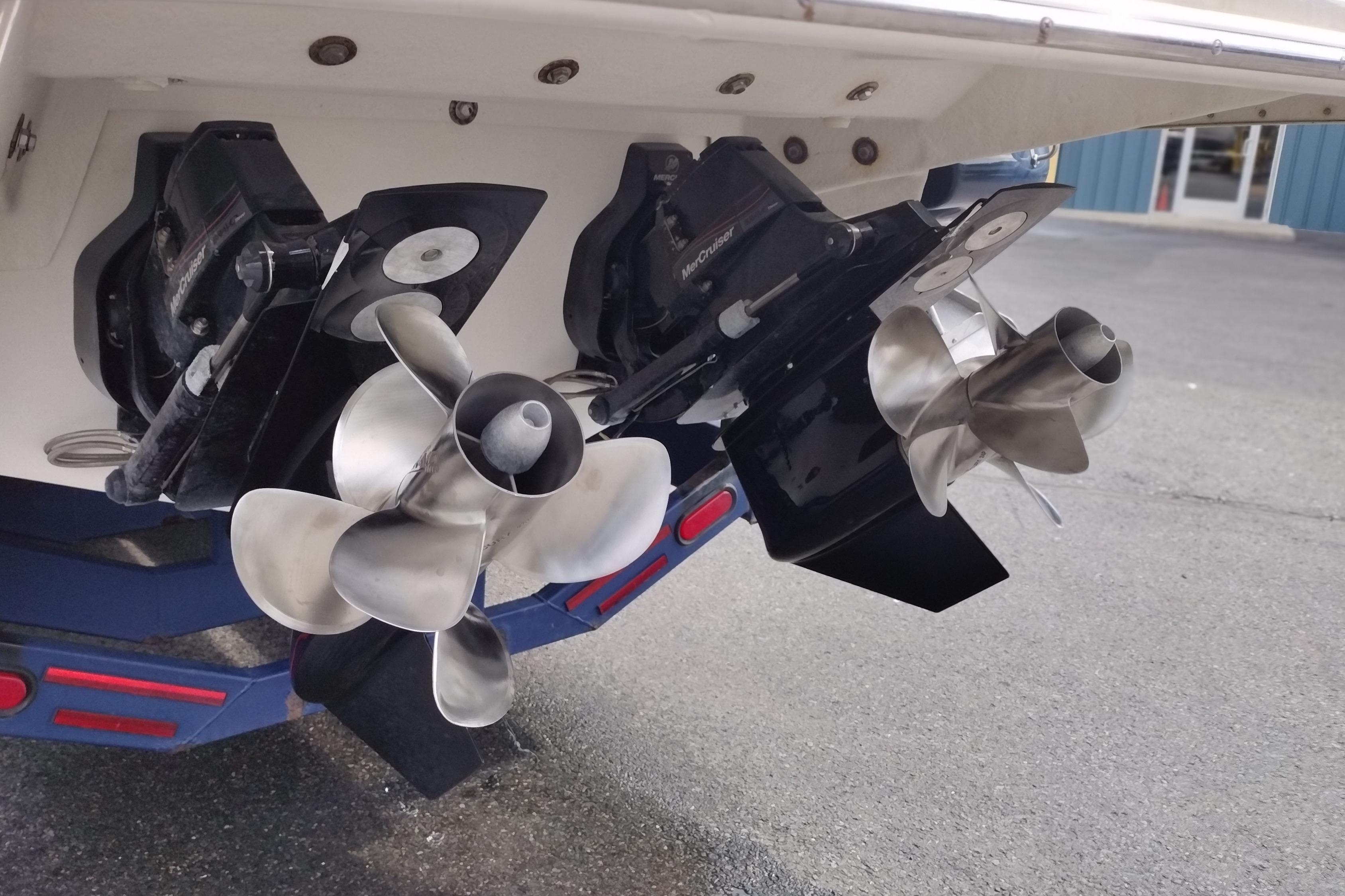 Dual propellers on a 2013 Sea Ray 300 SLX boat, showcasing sleek design.