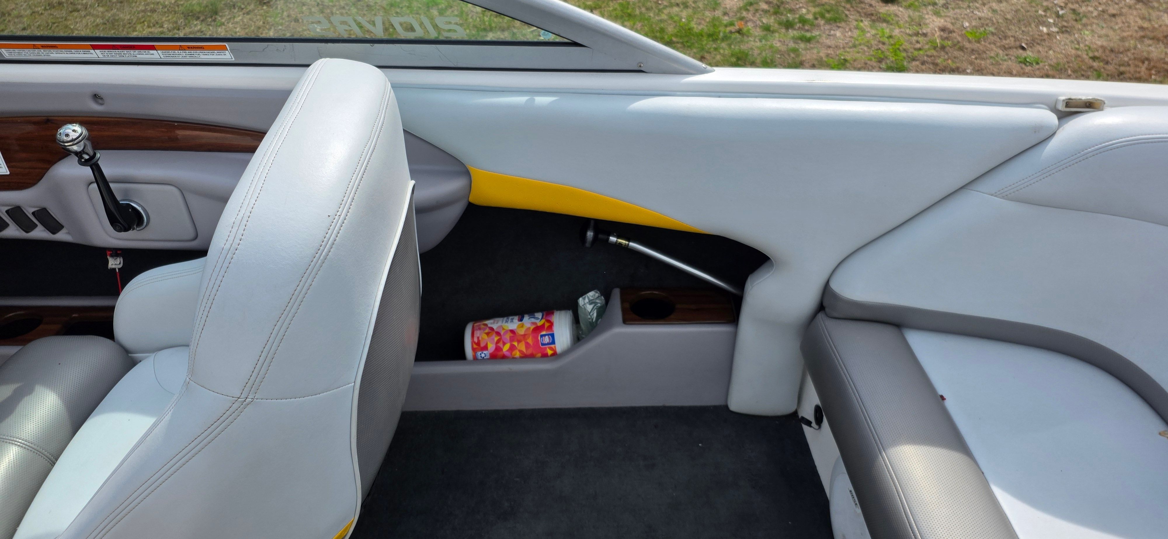 Interior of a 2004 MasterCraft Maristar boat with gray seating.