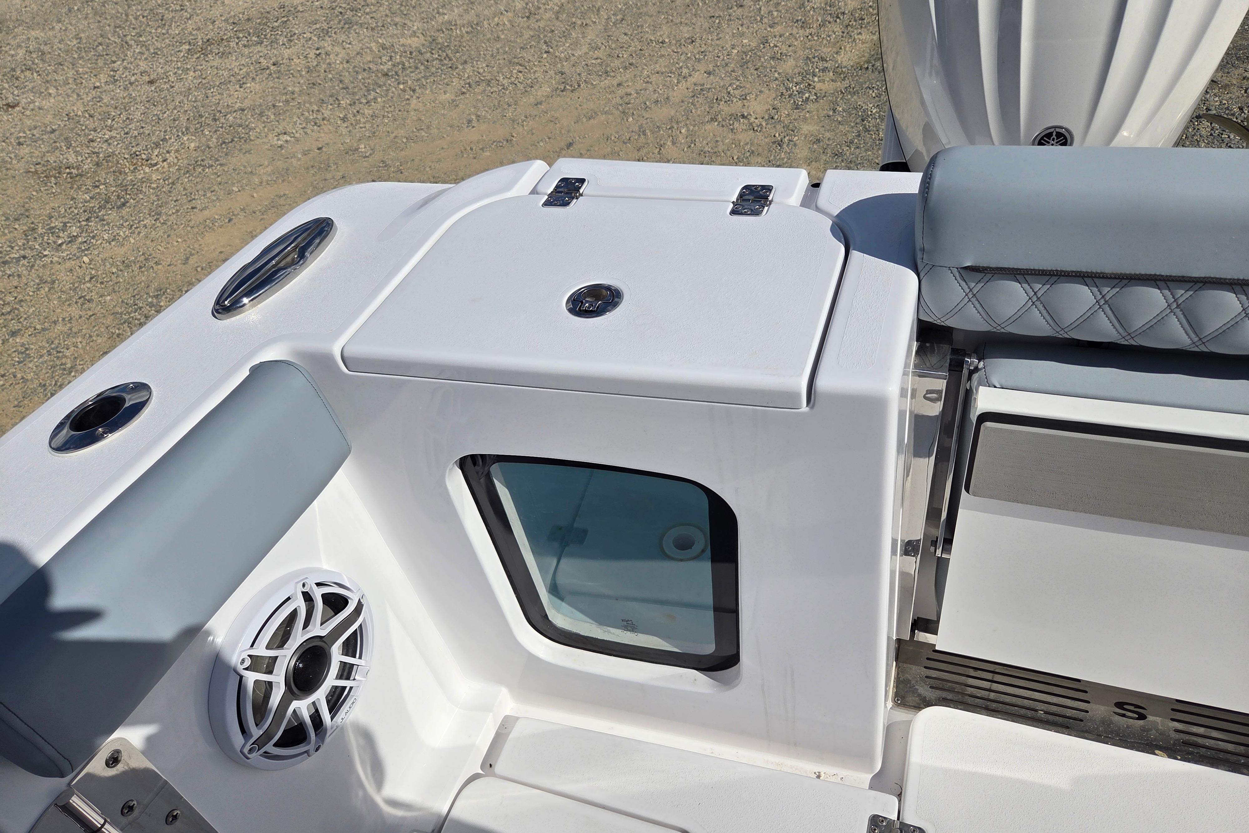 2026 Sportsman Open 282 Center Console boat interior with seating and speaker detail.