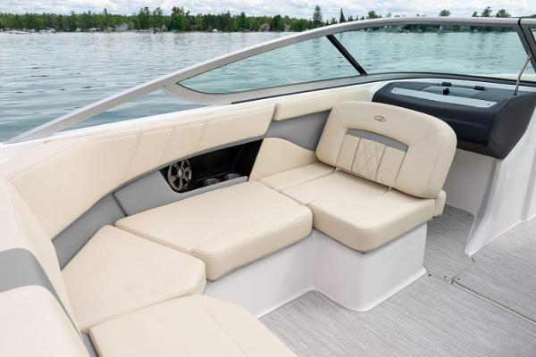 Manufacturer Provided Image: 2026 Regal 2000 ES boat interior with beige seating on a calm lake.