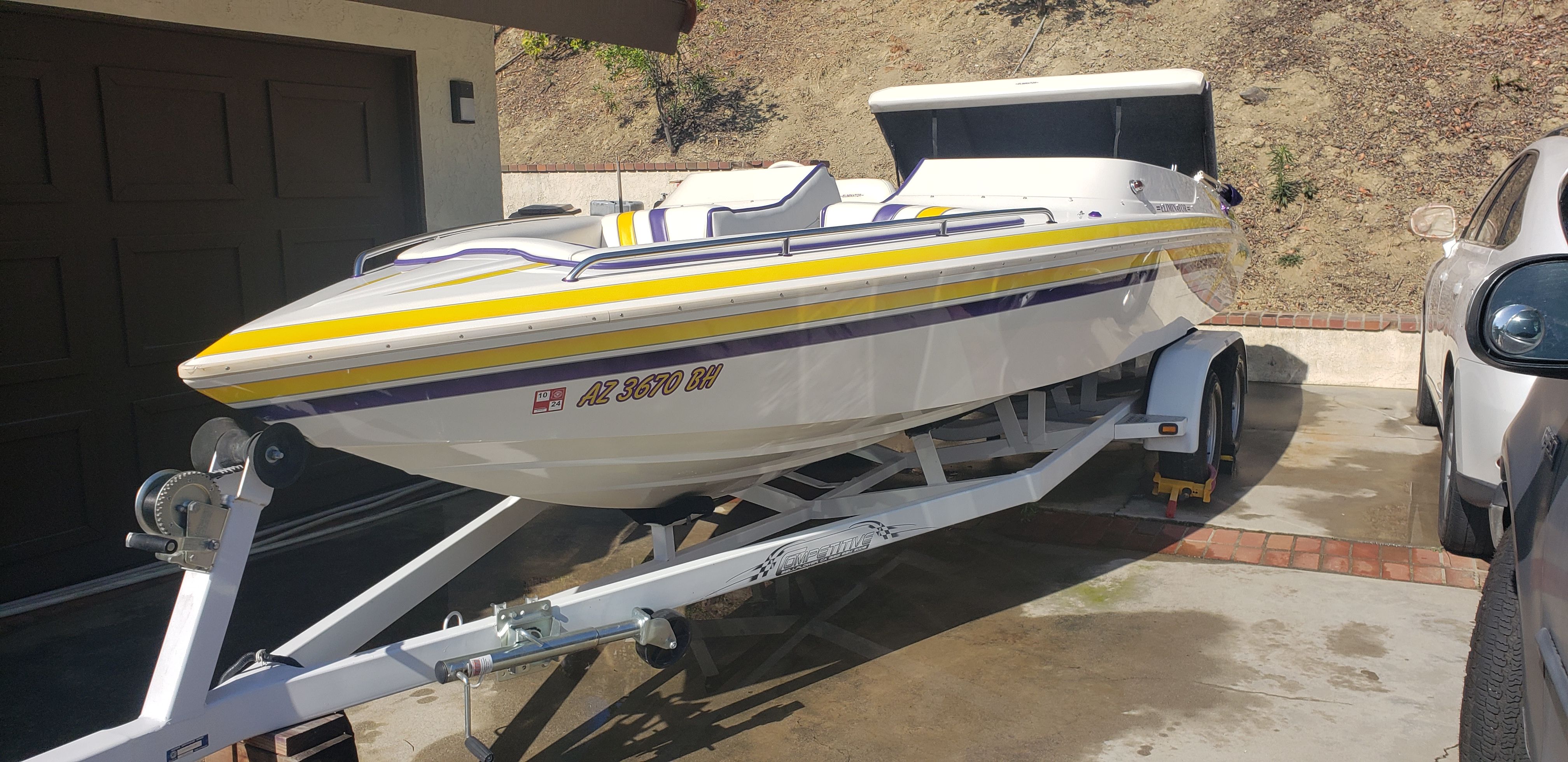 1999 Eliminator 220 Eagle XP boat parked on trailer.
