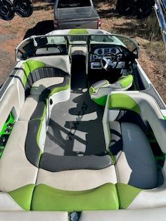 Interior of an MB F22 Tomcat boat with green and gray seating.
