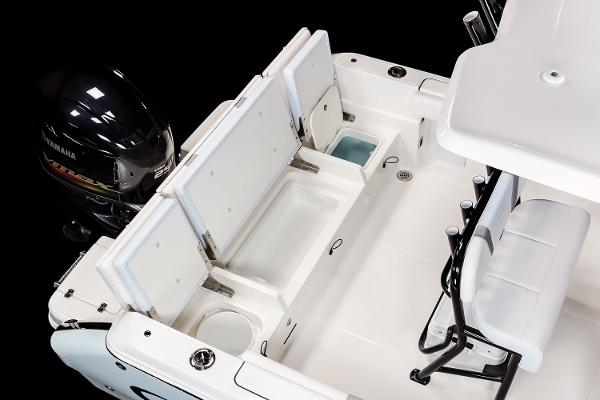Manufacturer Provided Image: 2025 Robalo R232 Explorer boat interior with Yamaha engine, featuring seating and storage compartments.