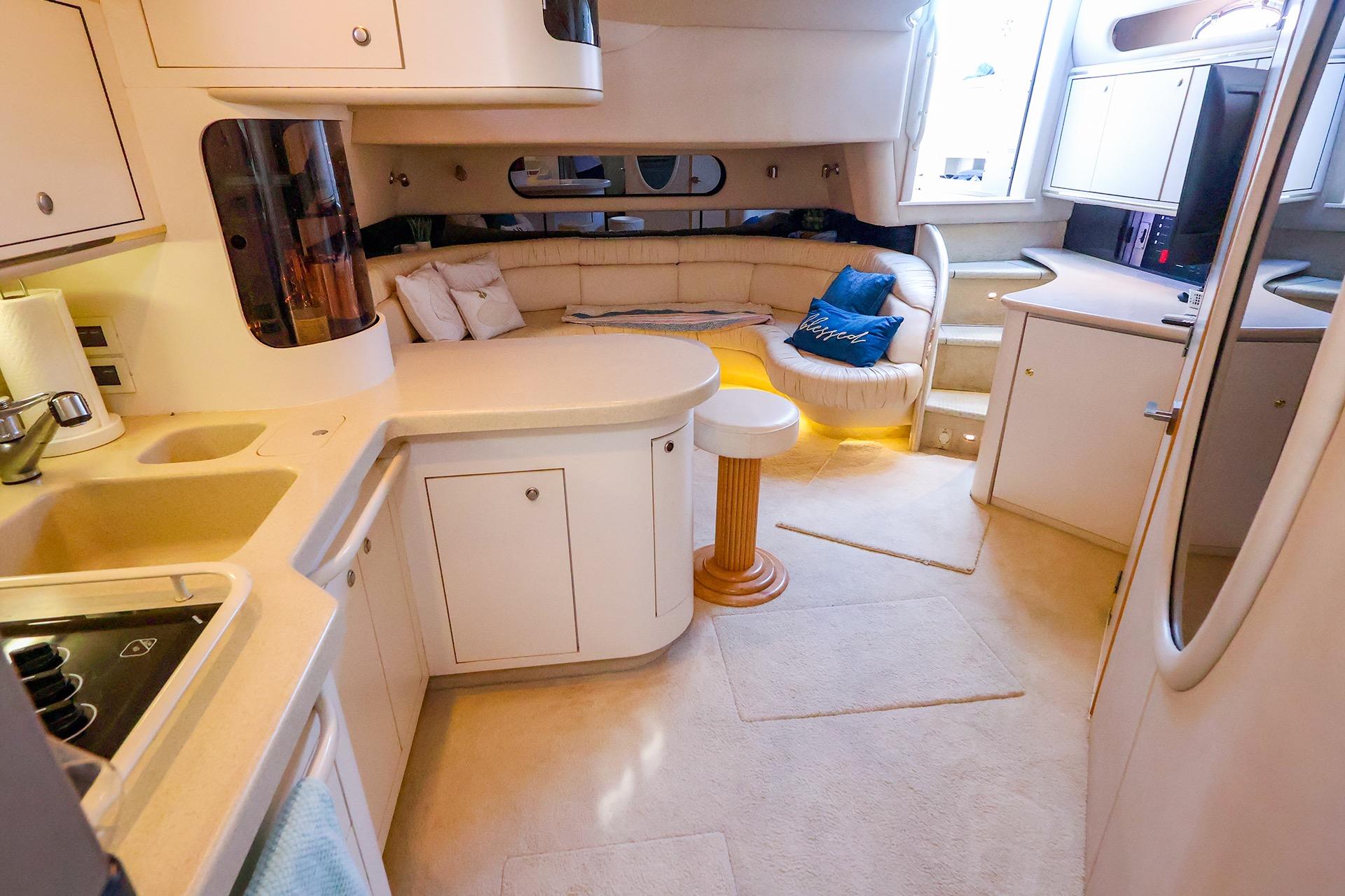 Luxurious interior of a 1998 Sea Ray 500 Sundancer yacht with modern amenities.