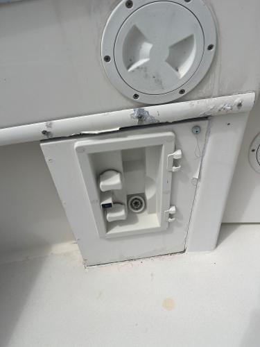 1985 Hatteras 45 Convertible boat deck detail with utility access panel.