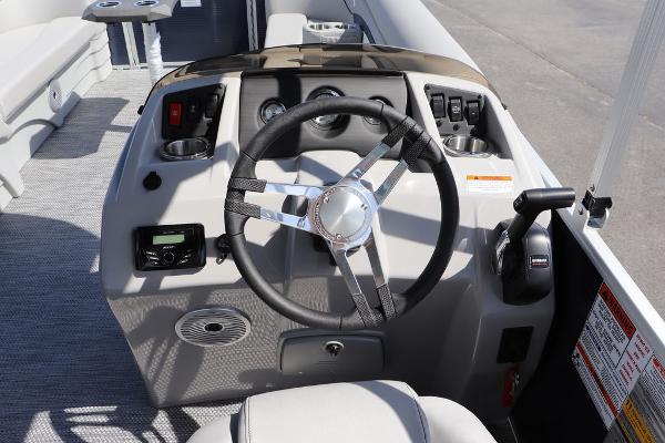 2024 Bennington 21 SSR boat helm with steering wheel and control panel.