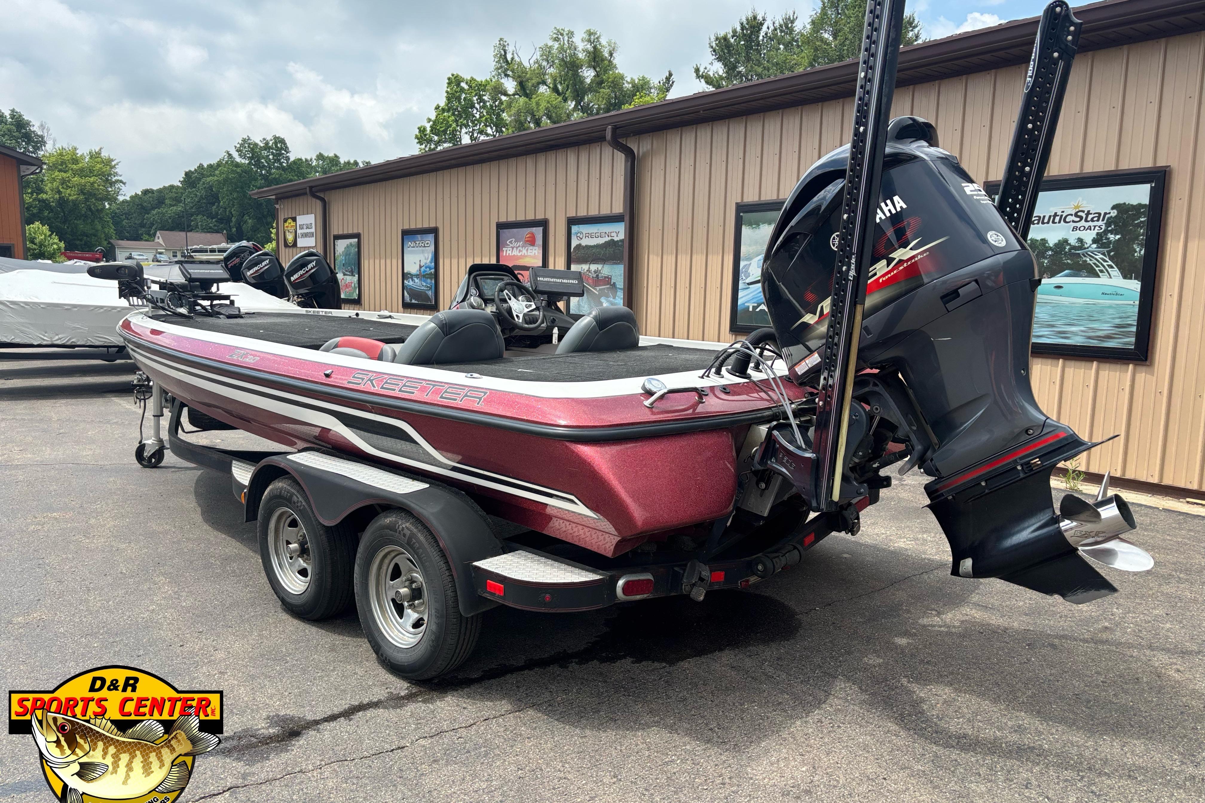 2013 Skeeter ZX20 boat with Yamaha motor, parked outside D&R Sports Center.