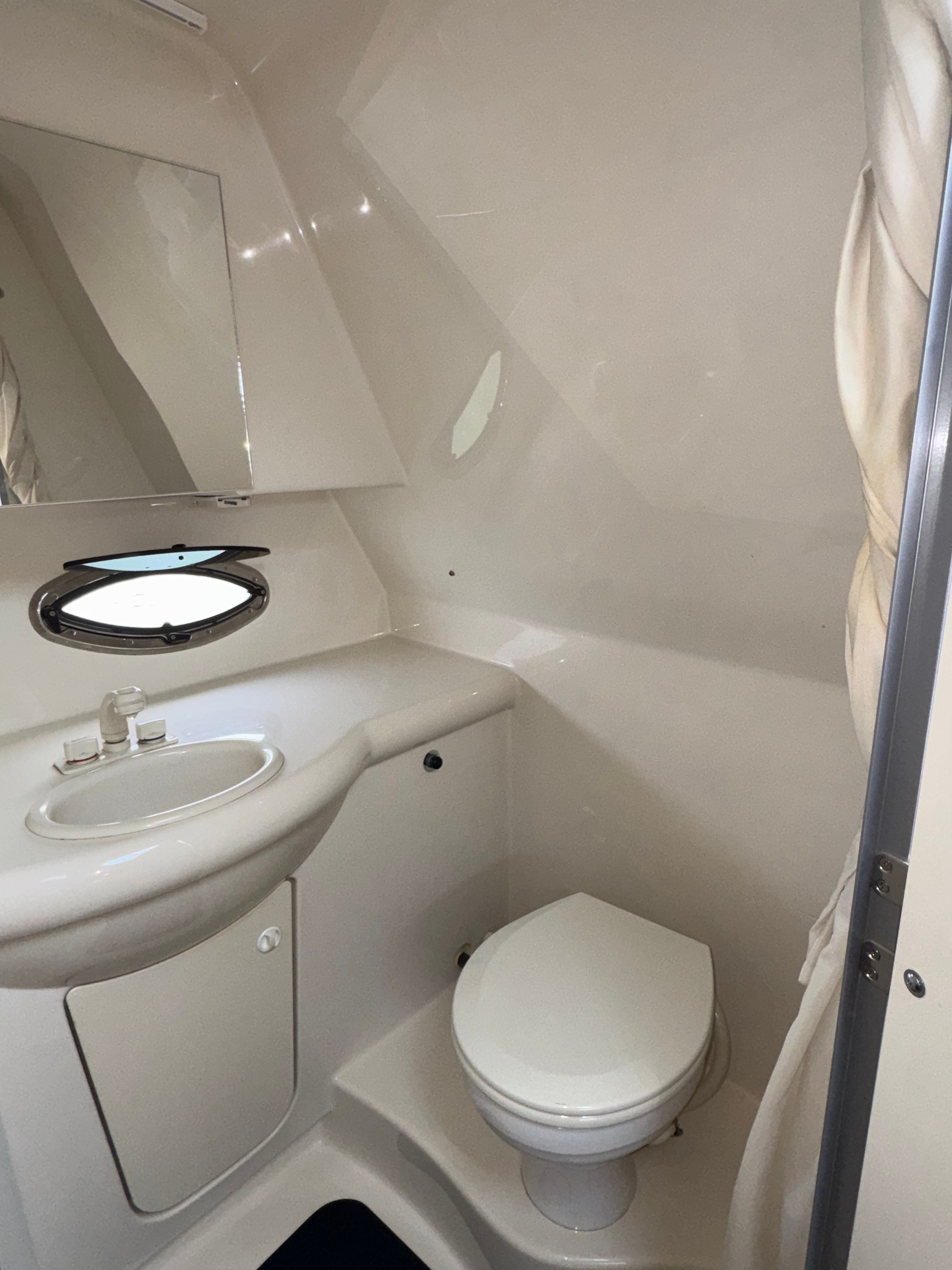 Interior view of the bathroom on a 2008 Bayliner 340 yacht.