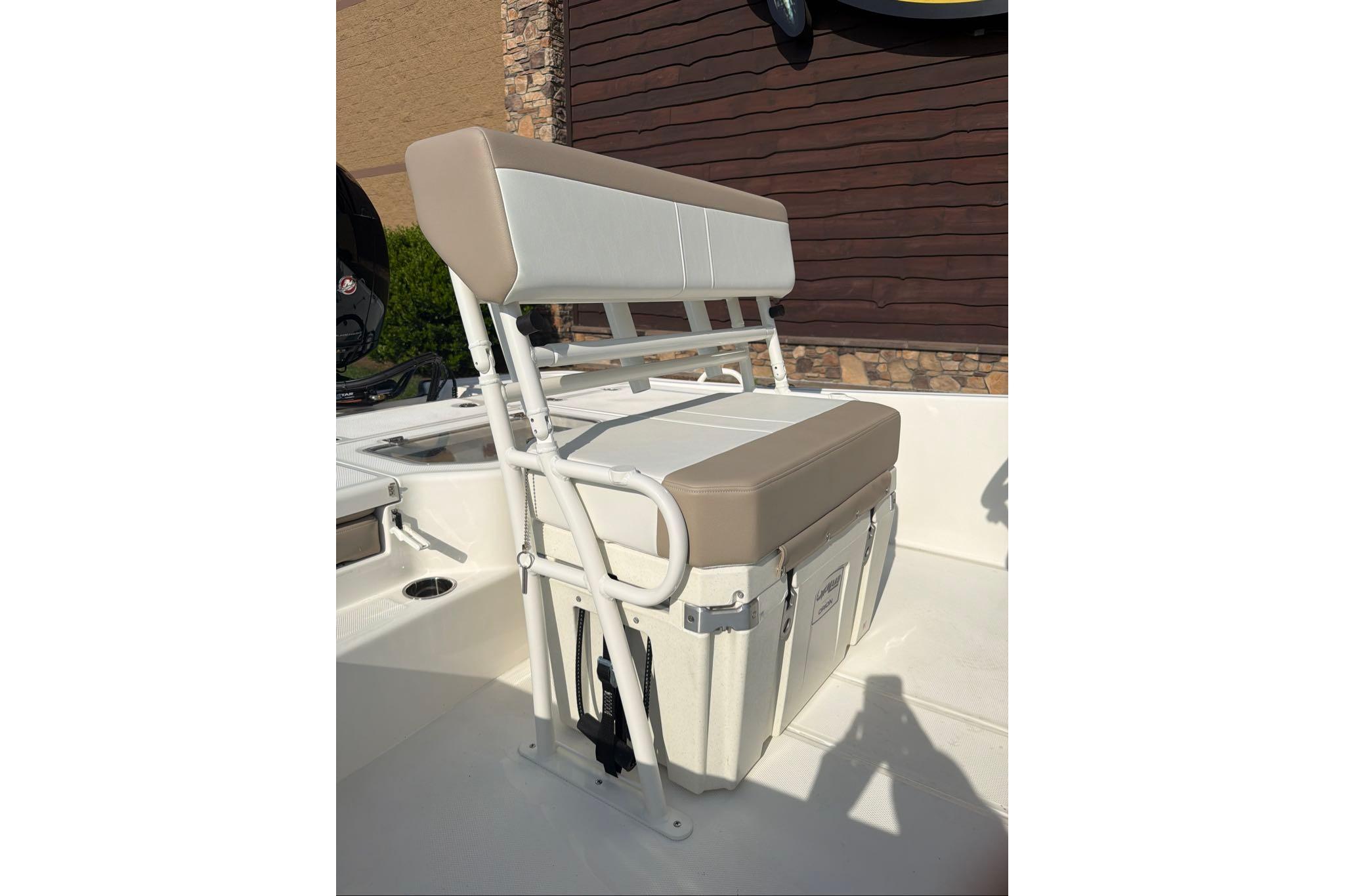 2026 Mako Pro Skiff 19 CC boat seat with integrated cooler, beige and white design.